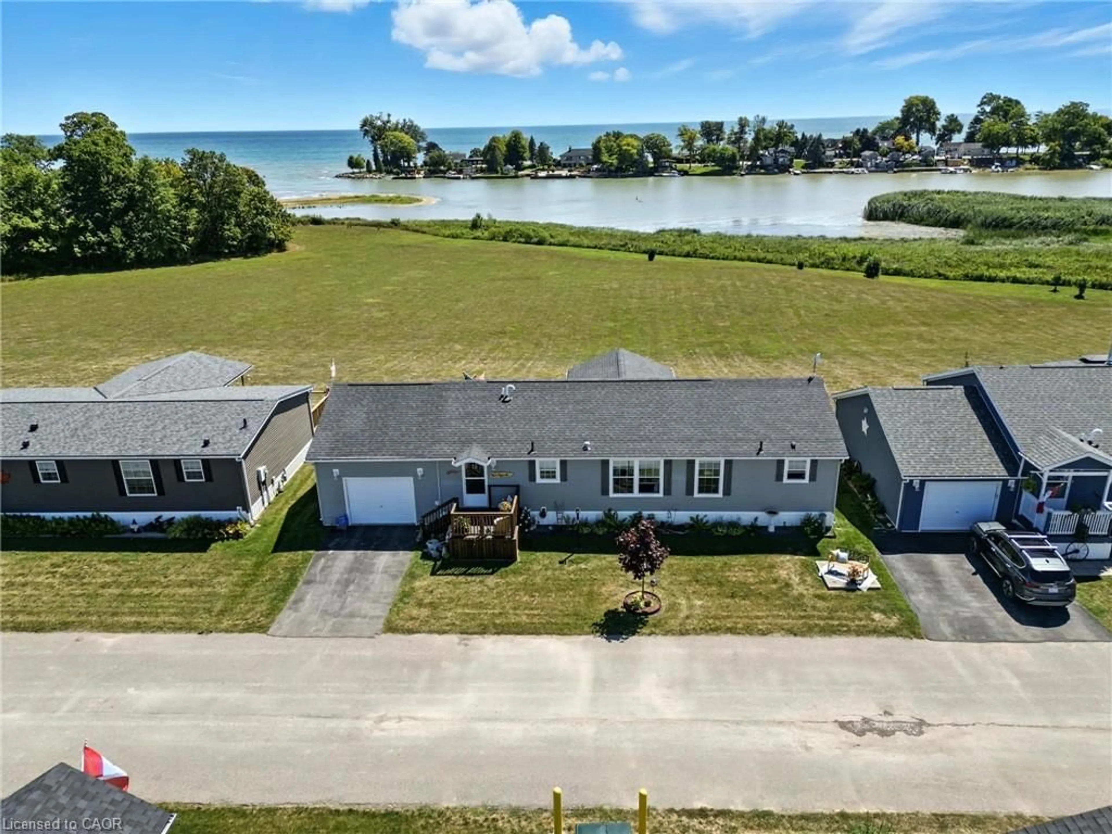 A pic from outside/outdoor area/front of a property/back of a property/a pic from drone, water/lake/river/ocean view for 55 Riverbend Cres, Nanticoke Ontario N0A 1L0