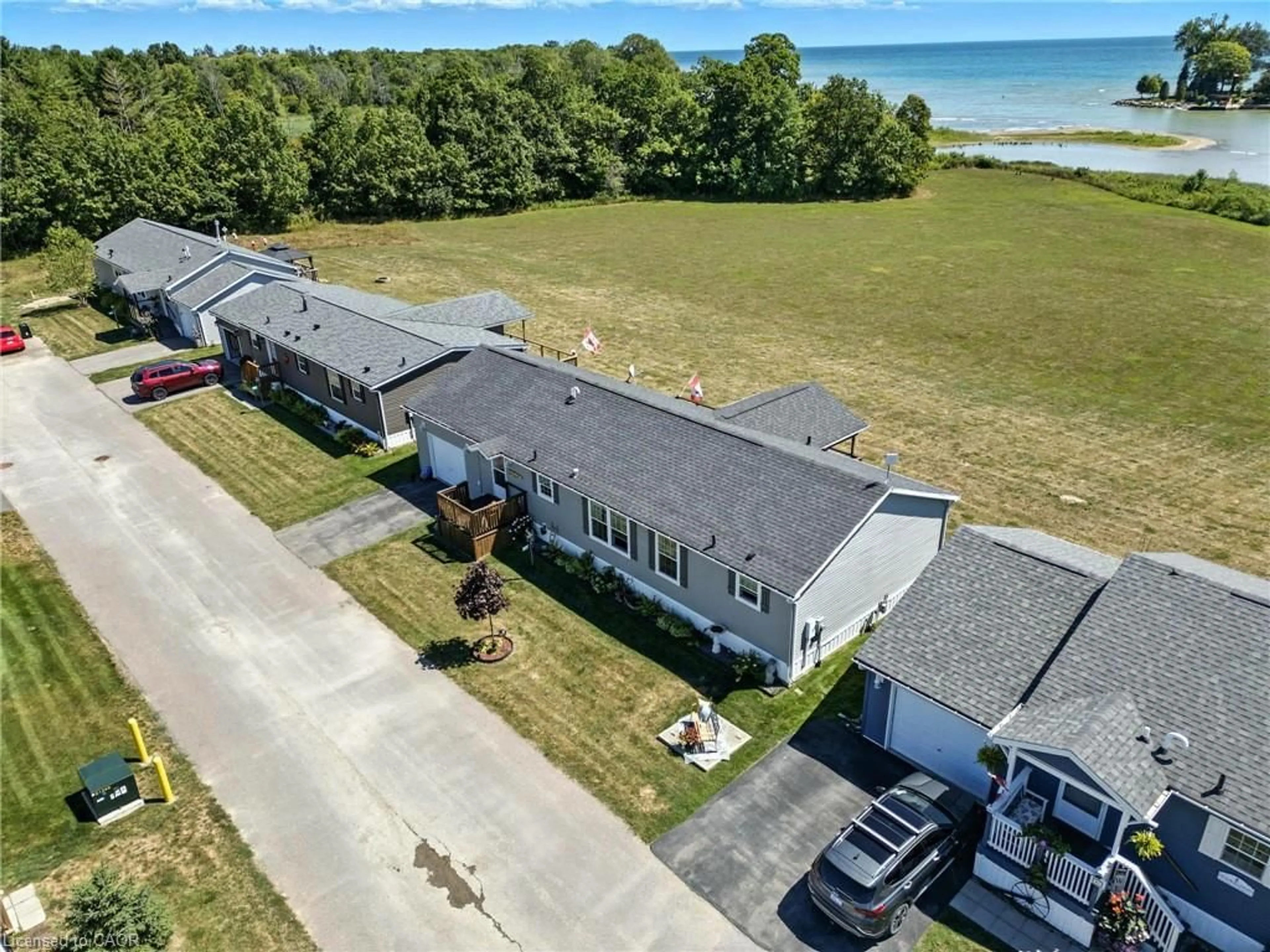 A pic from outside/outdoor area/front of a property/back of a property/a pic from drone, water/lake/river/ocean view for 55 Riverbend Cres, Nanticoke Ontario N0A 1L0