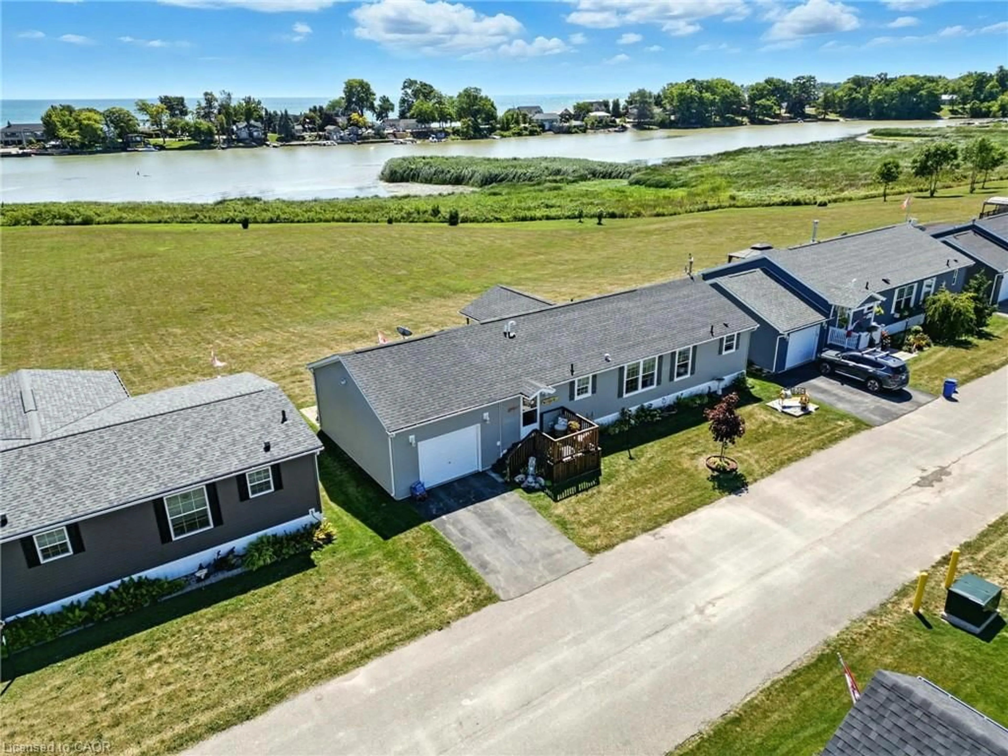A pic from outside/outdoor area/front of a property/back of a property/a pic from drone, water/lake/river/ocean view for 55 Riverbend Cres, Nanticoke Ontario N0A 1L0