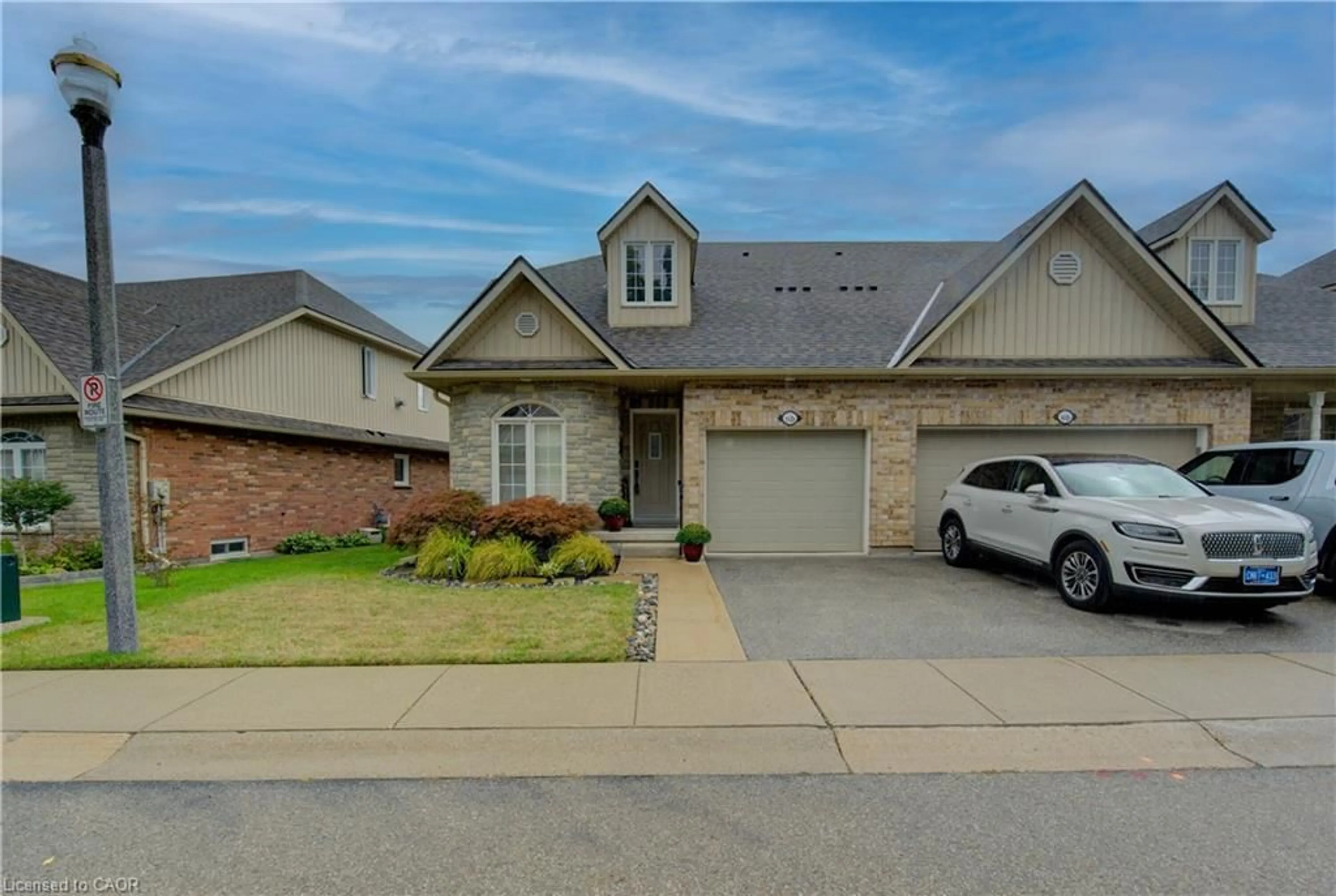 Home with brick exterior material, street for 350 Doon Valley Dr #11D, Kitchener Ontario N2P 2M9