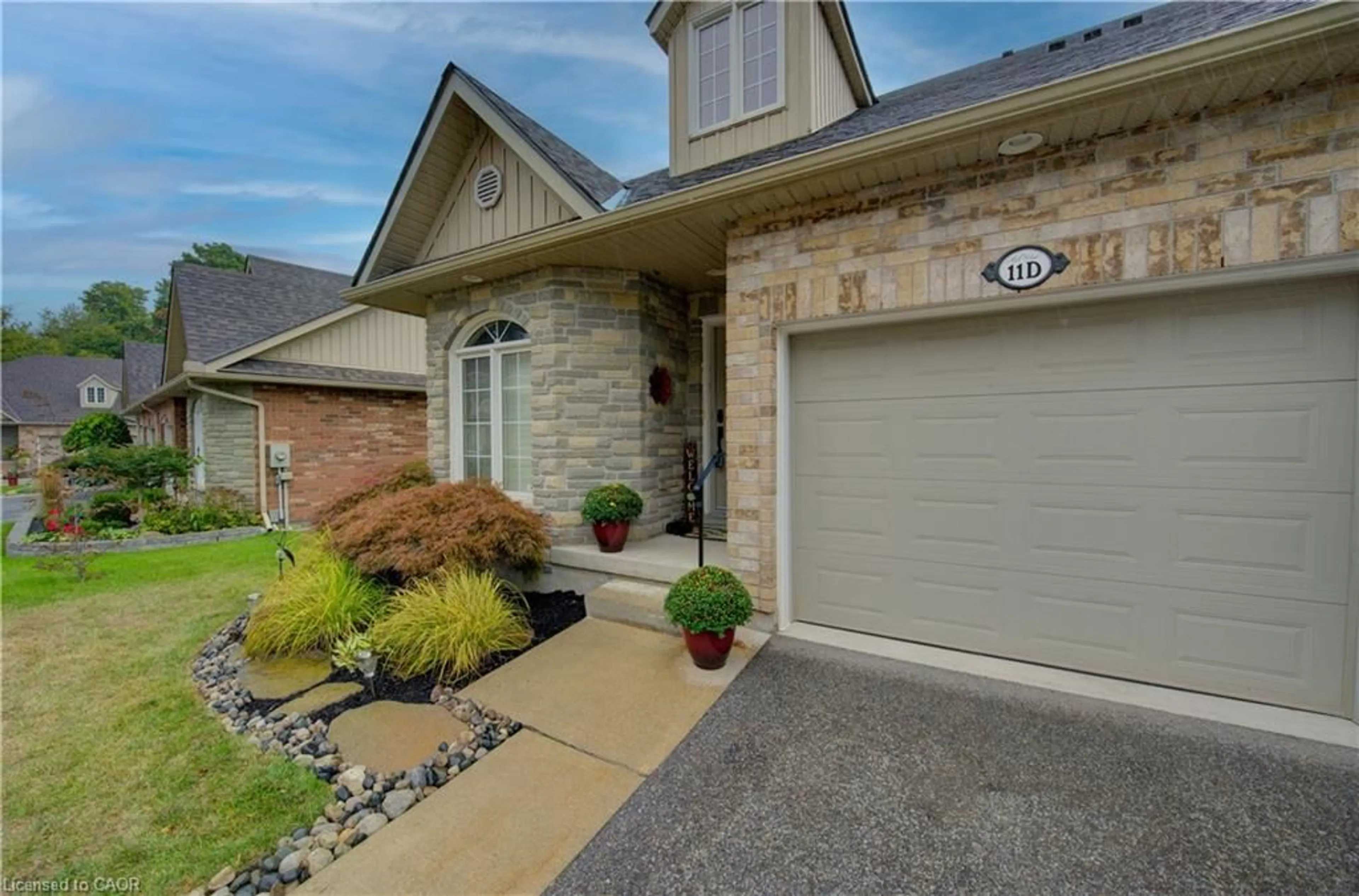 Home with brick exterior material, street for 350 Doon Valley Dr #11D, Kitchener Ontario N2P 2M9