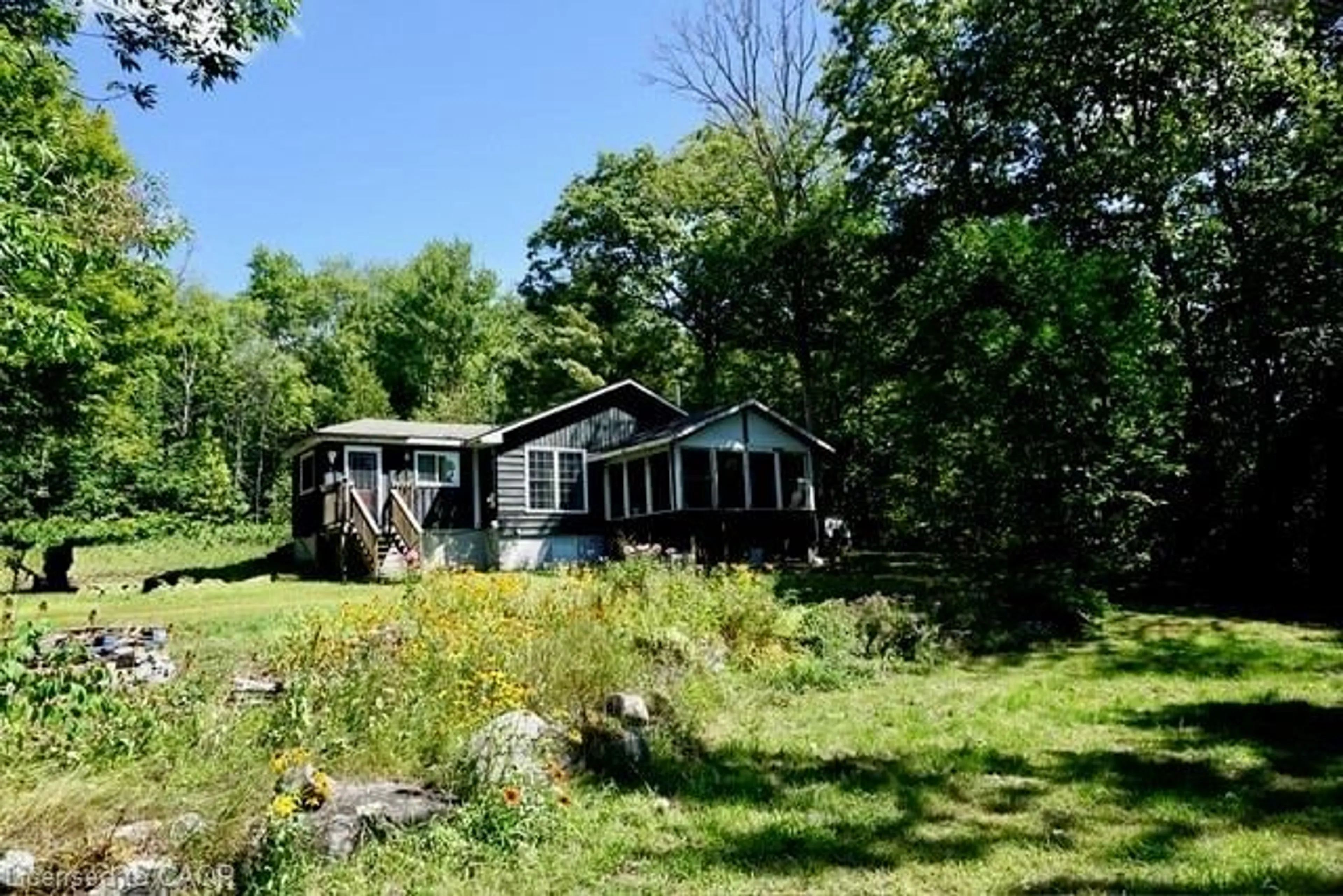 A pic from outside/outdoor area/front of a property/back of a property/a pic from drone, water/lake/river/ocean view for 1116 Moon River Rd, Bala Ontario P0C 1A0