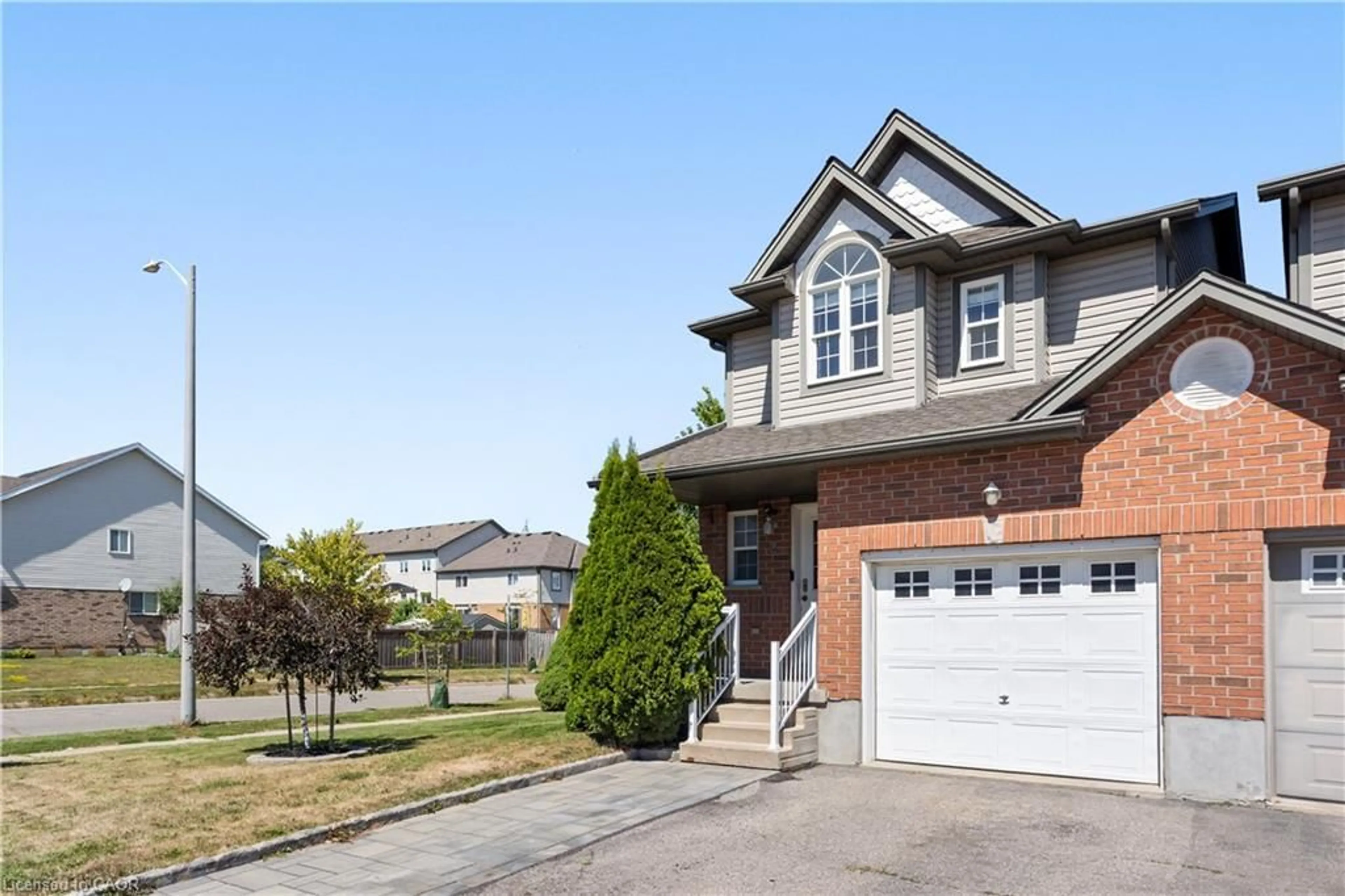 Home with brick exterior material, street for 2 Donnenwerth Dr, Kitchener Ontario N2E 3X2