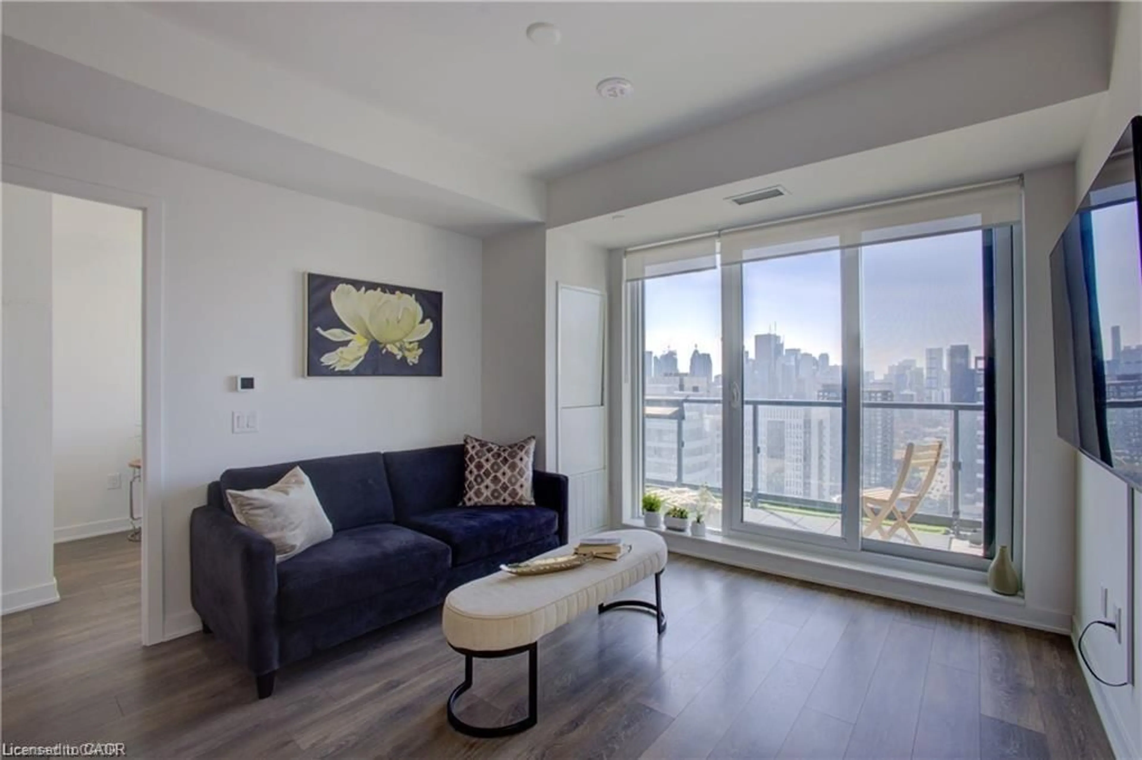 Living room with furniture, wood/laminate floor for 130 River St #2904, Toronto Ontario M5A 0R8