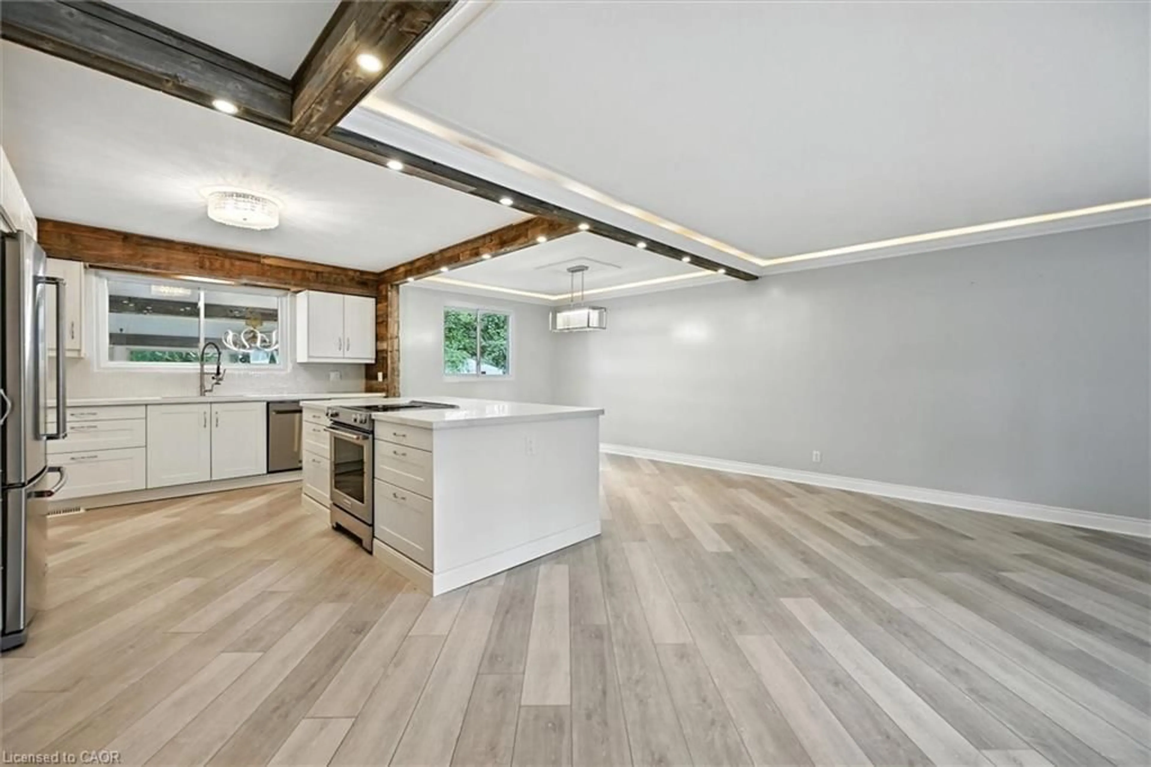 Open concept kitchen, wood/laminate floor for 1059 Marley Cres, Burlington Ontario L7T 3S3