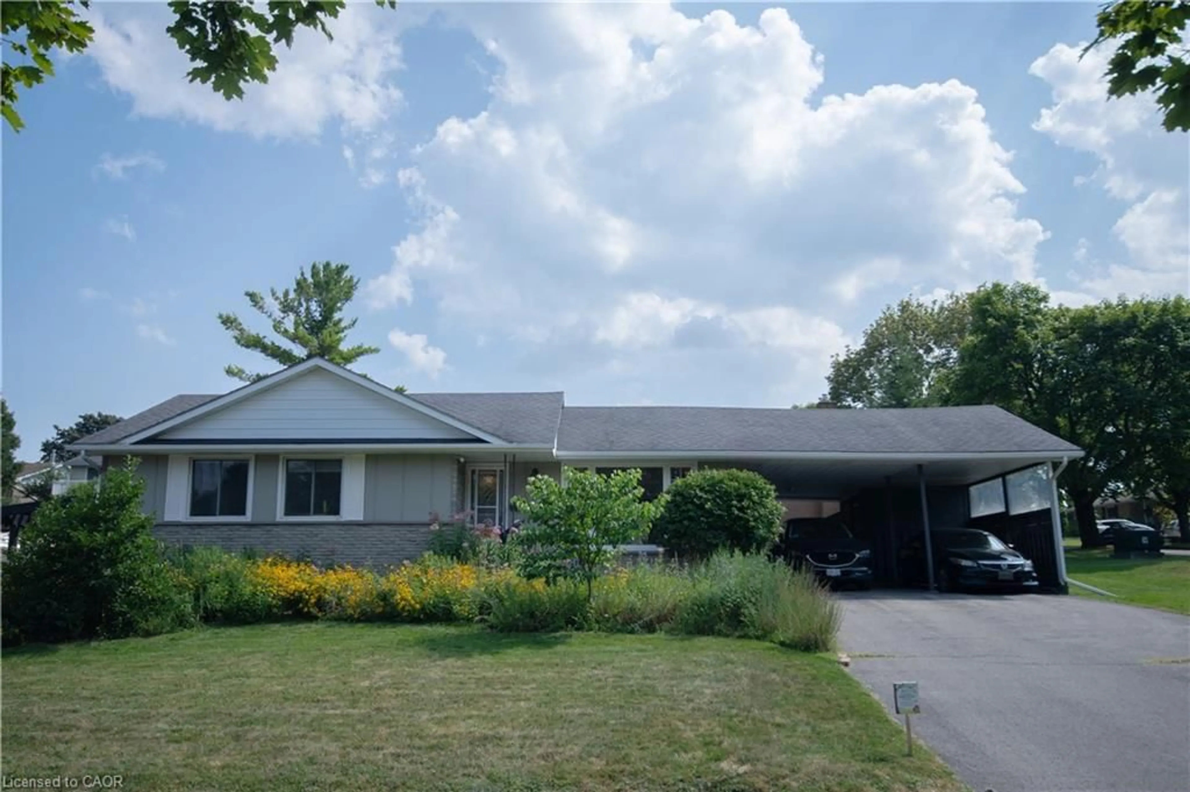 Home with vinyl exterior material, street for 2 Grenada Dr, Simcoe Ontario N3Y 3E7