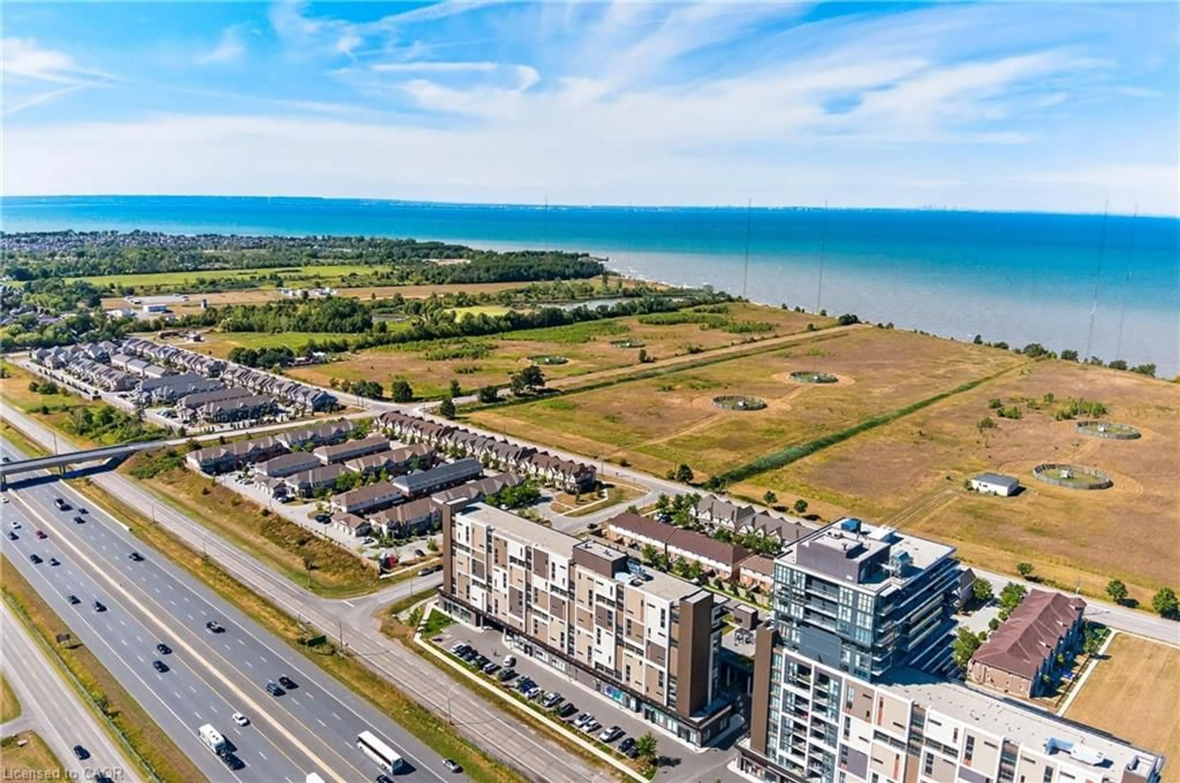 A pic from outside/outdoor area/front of a property/back of a property/a pic from drone, water/lake/river/ocean view for 560 North Service Rd #505, Grimsby Ontario L3M 0G3
