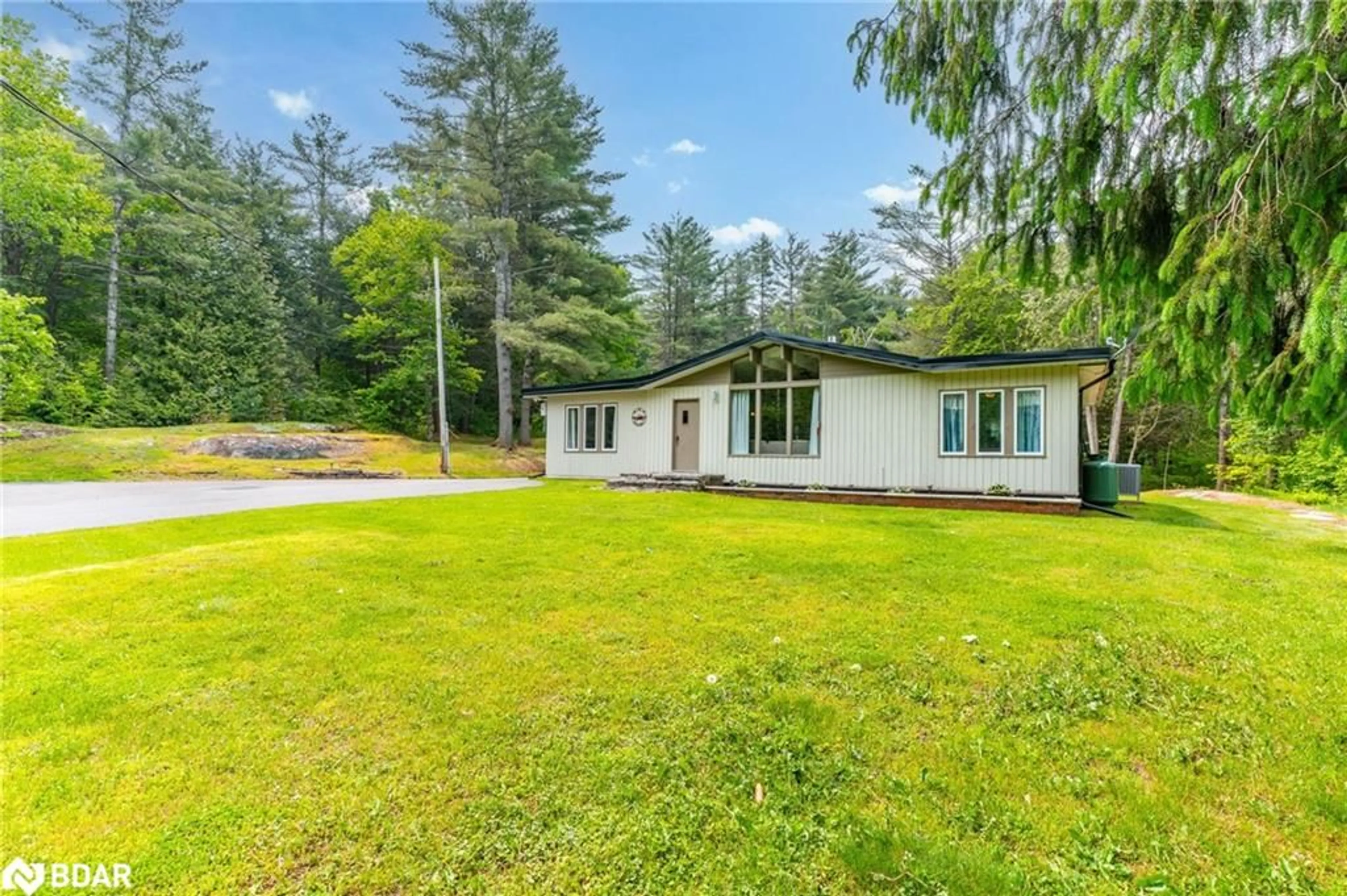 A pic from outside/outdoor area/front of a property/back of a property/a pic from drone, water/lake/river/ocean view for 4001 County Rd 121, Kawartha Lakes Ontario K0M 2A0