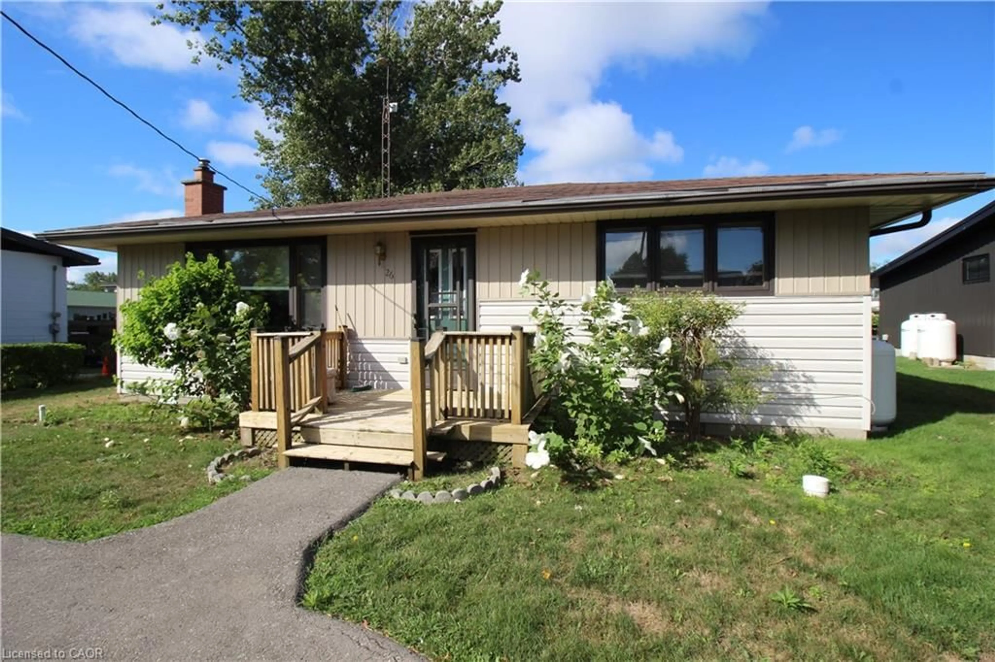 Home with vinyl exterior material, street for 26 Pickerel Rd, Long Point Ontario N0E 1M0