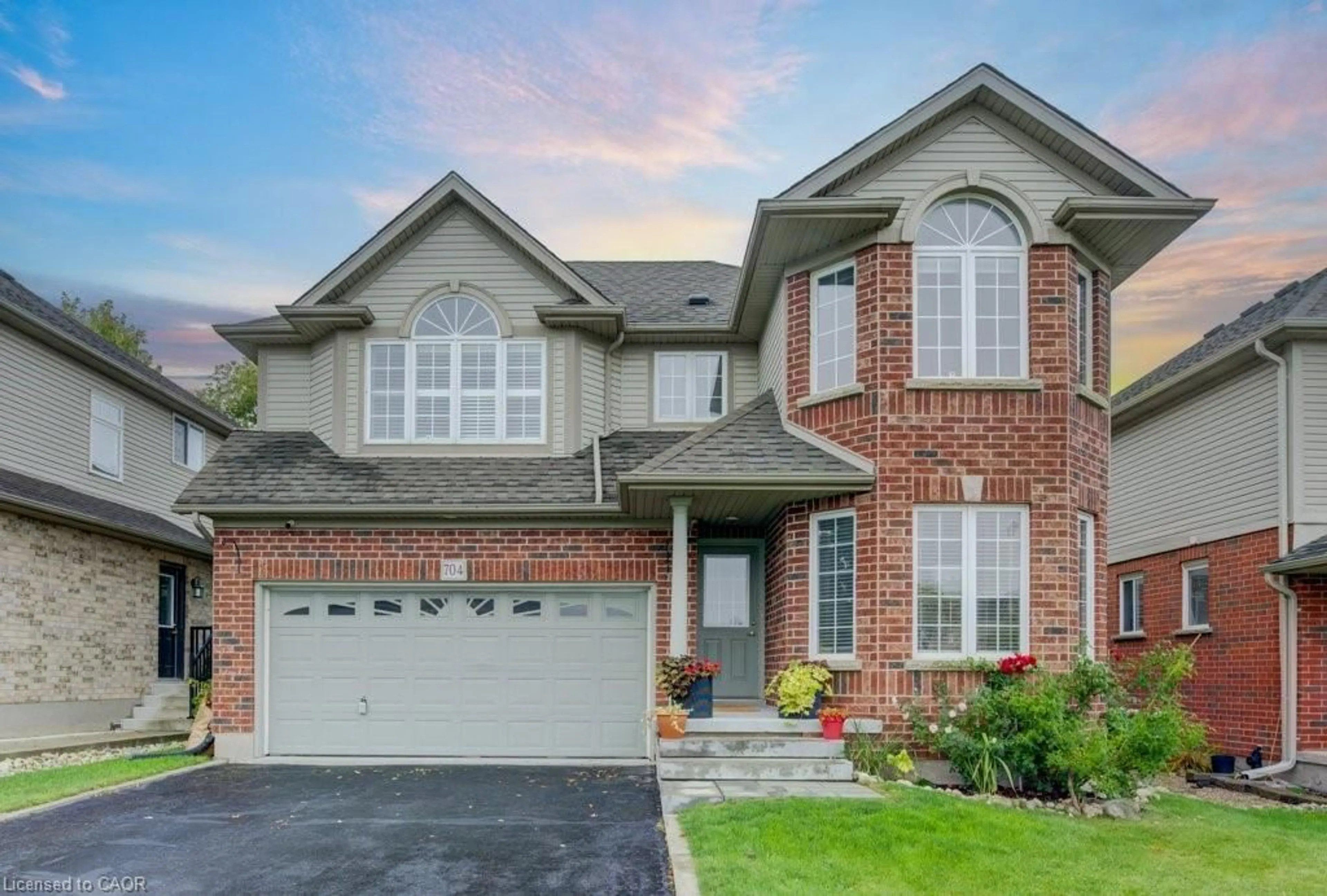 Home with brick exterior material, street for 704 Shediac Cres, Waterloo Ontario N2K 4H5