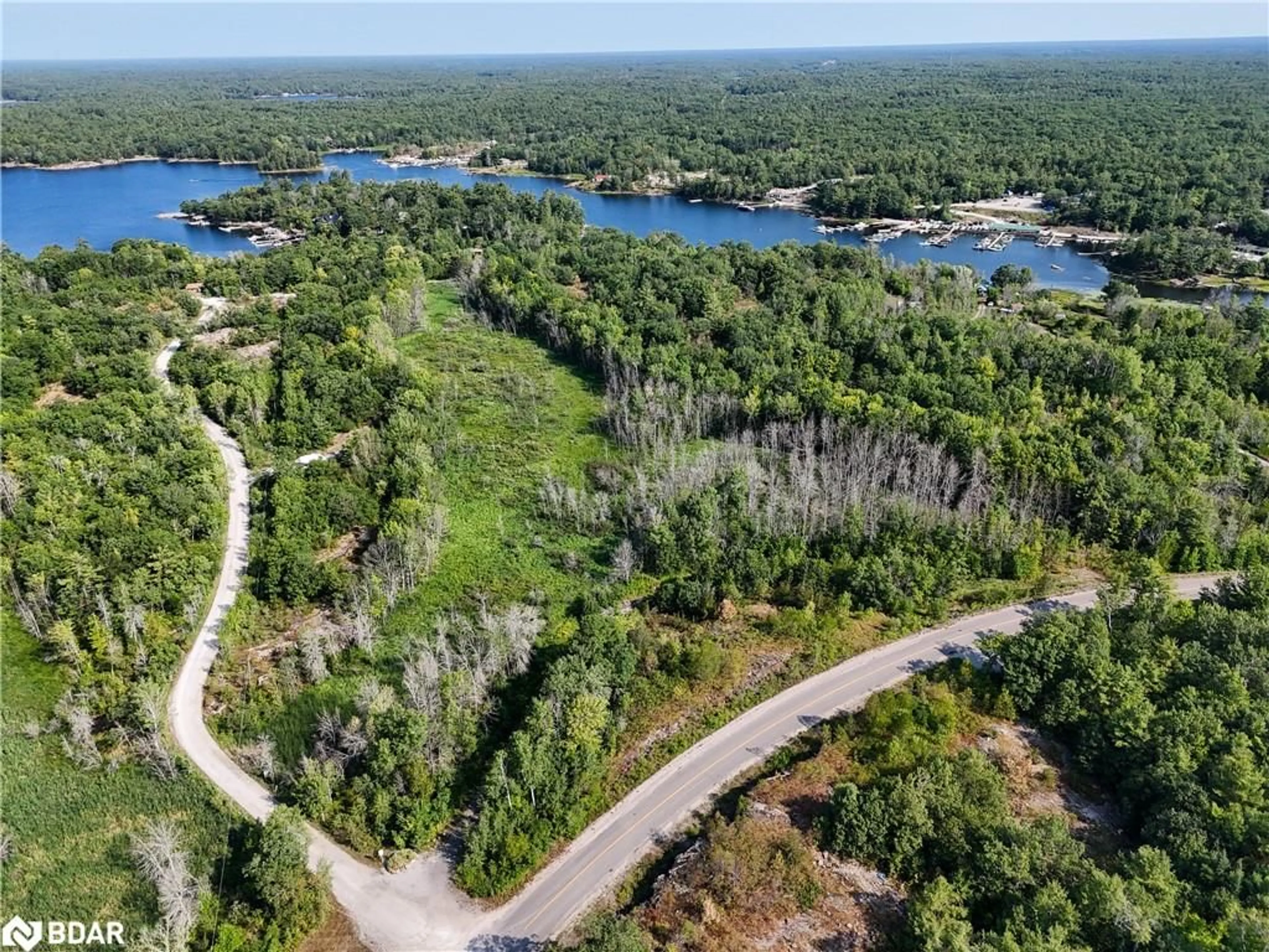 A pic from outside/outdoor area/front of a property/back of a property/a pic from drone, forest/trees view for 30 Birch Acres Dr, Port Severn Ontario L0K 1S0