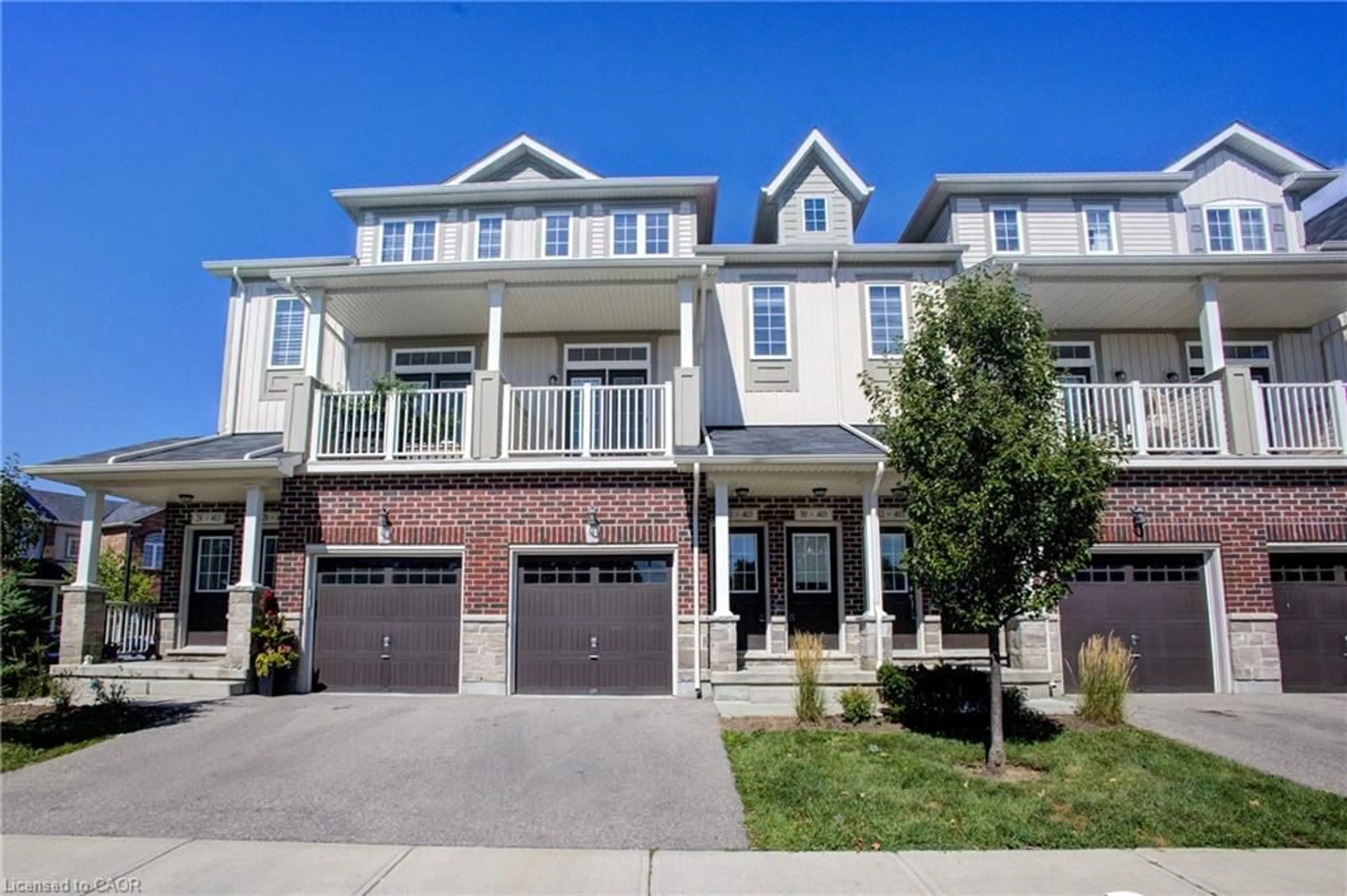 Home with brick exterior material, street for 403 Westwood Dr #31, Kitchener Ontario N2M 5B5