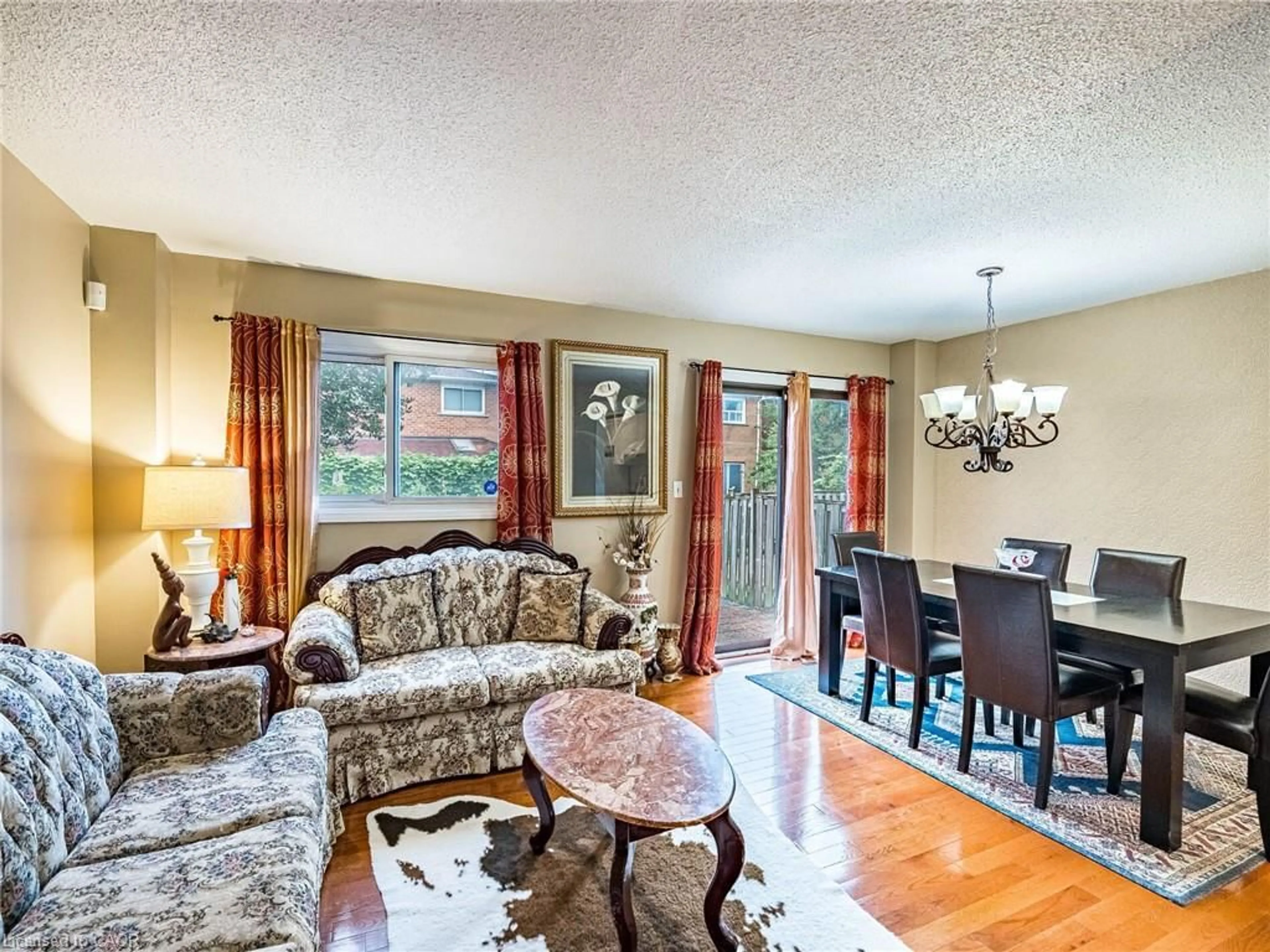 Living room with furniture, wood/laminate floor for 69 New Seabury Dr, Concord Ontario L4K 2B7