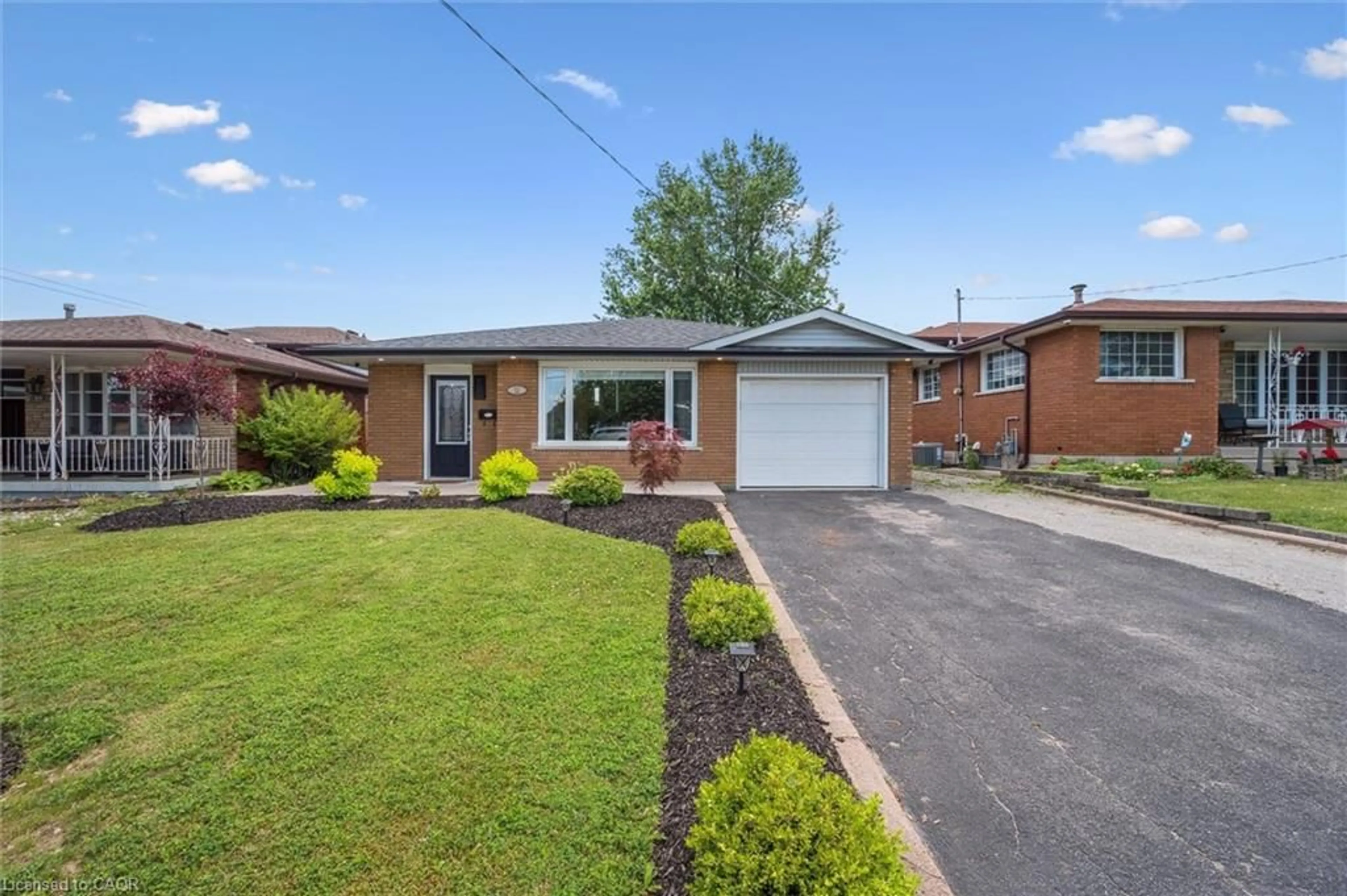 Home with brick exterior material, street for 12 Anson Ave, Hamilton Ontario L8T 2X3