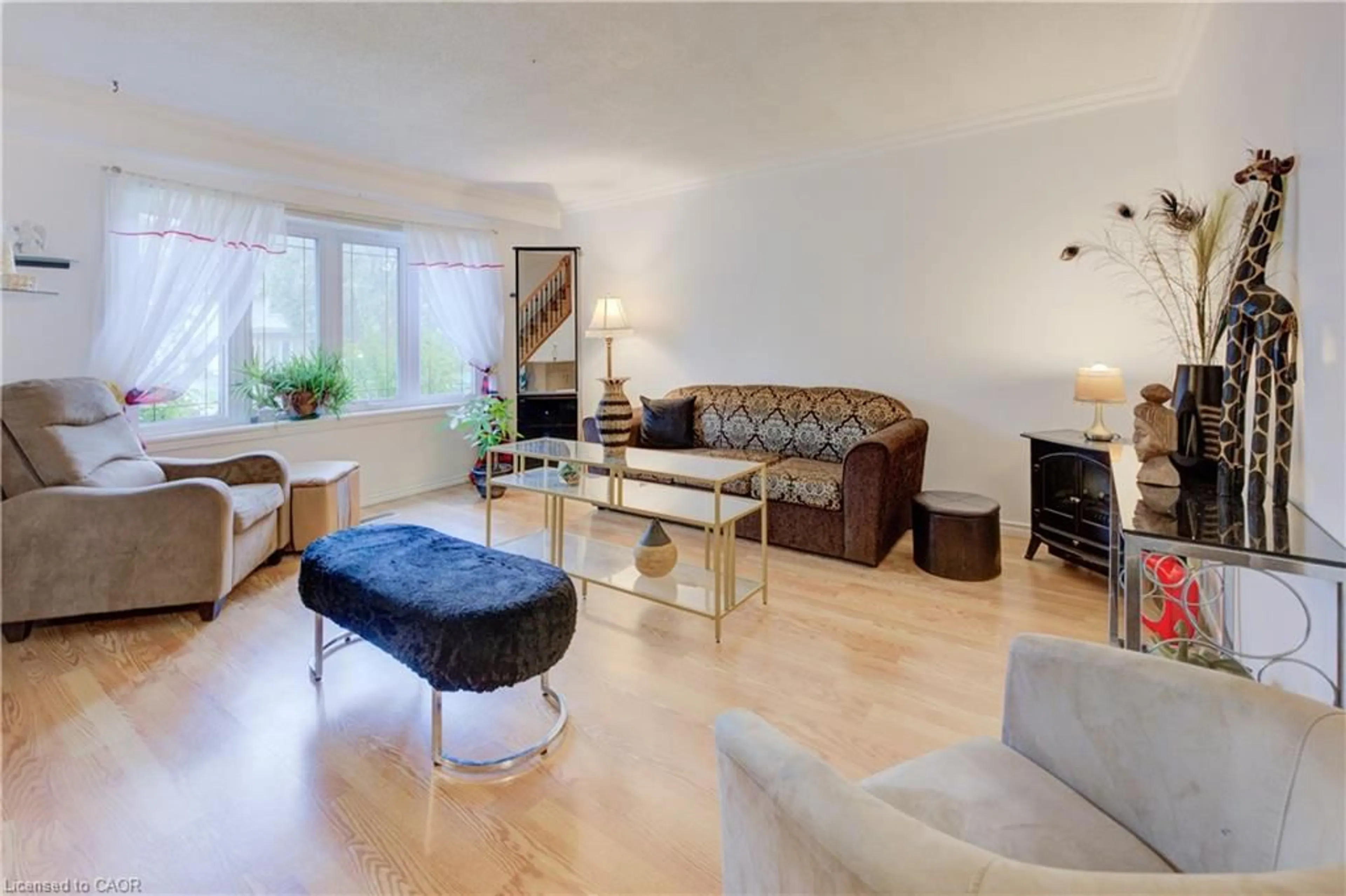 Living room with furniture, wood/laminate floor for 82 Timberlane Cres, Kitchener Ontario N2N 1S9