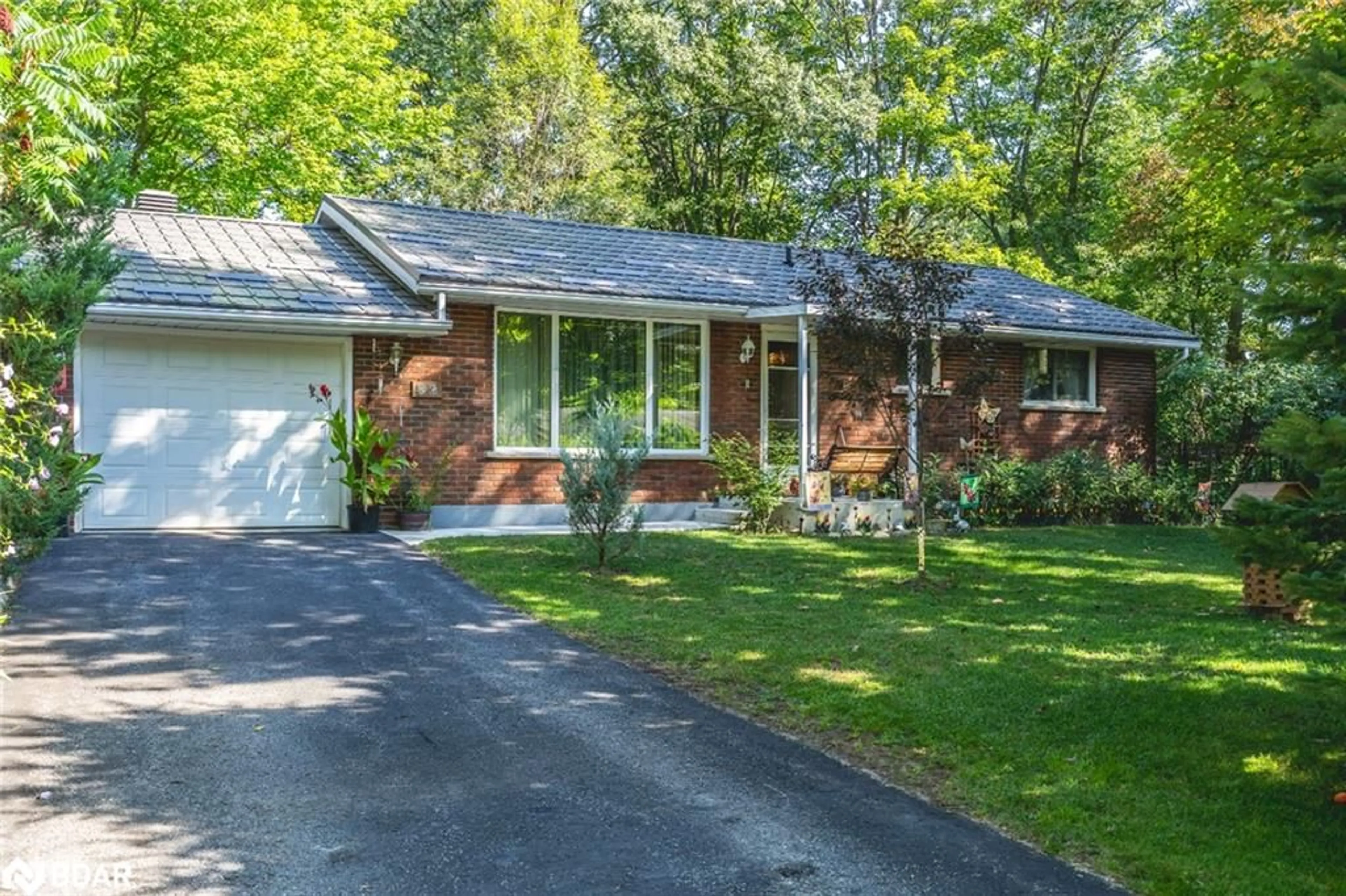 Home with brick exterior material, street for 82 Helena St, Wasaga Beach Ontario L9Z 1R1