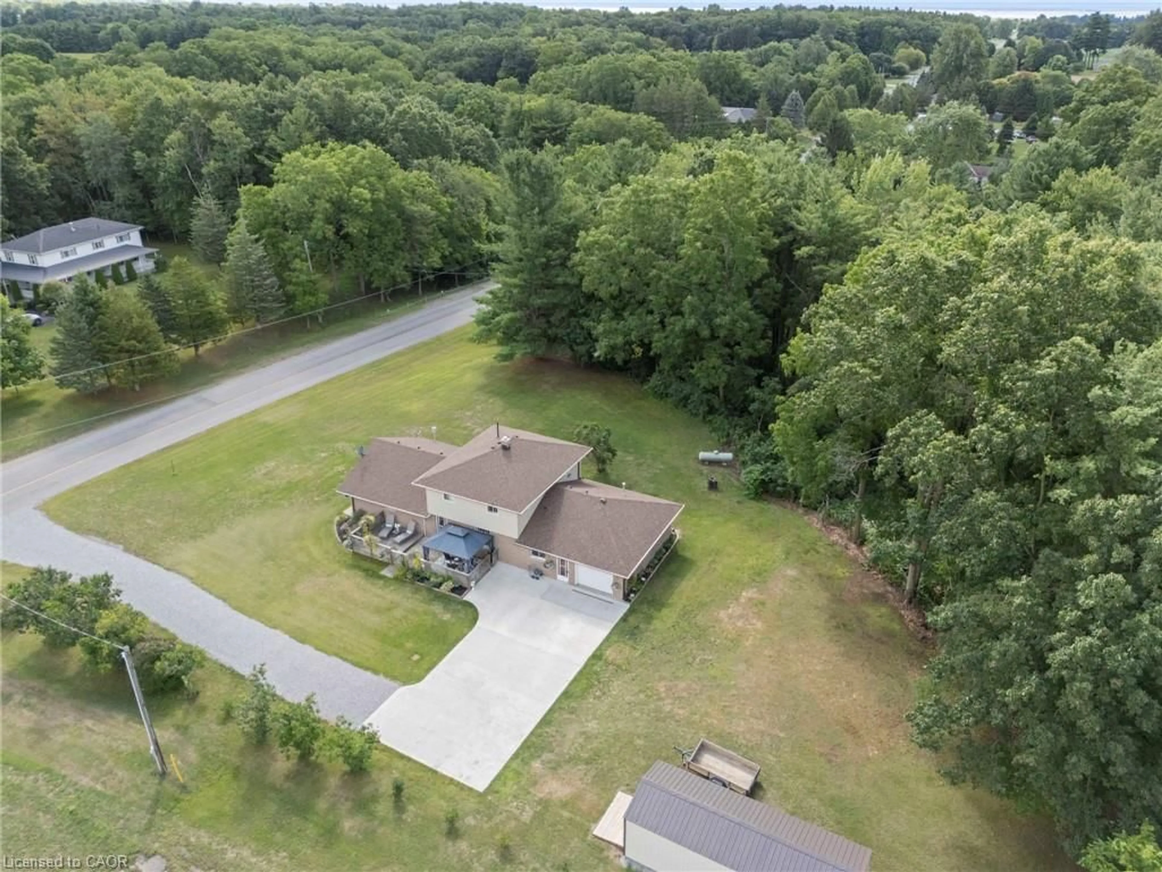 A pic from outside/outdoor area/front of a property/back of a property/a pic from drone, water/lake/river/ocean view for 275 West Quarter Line, Forestville Ontario N0E 1P0