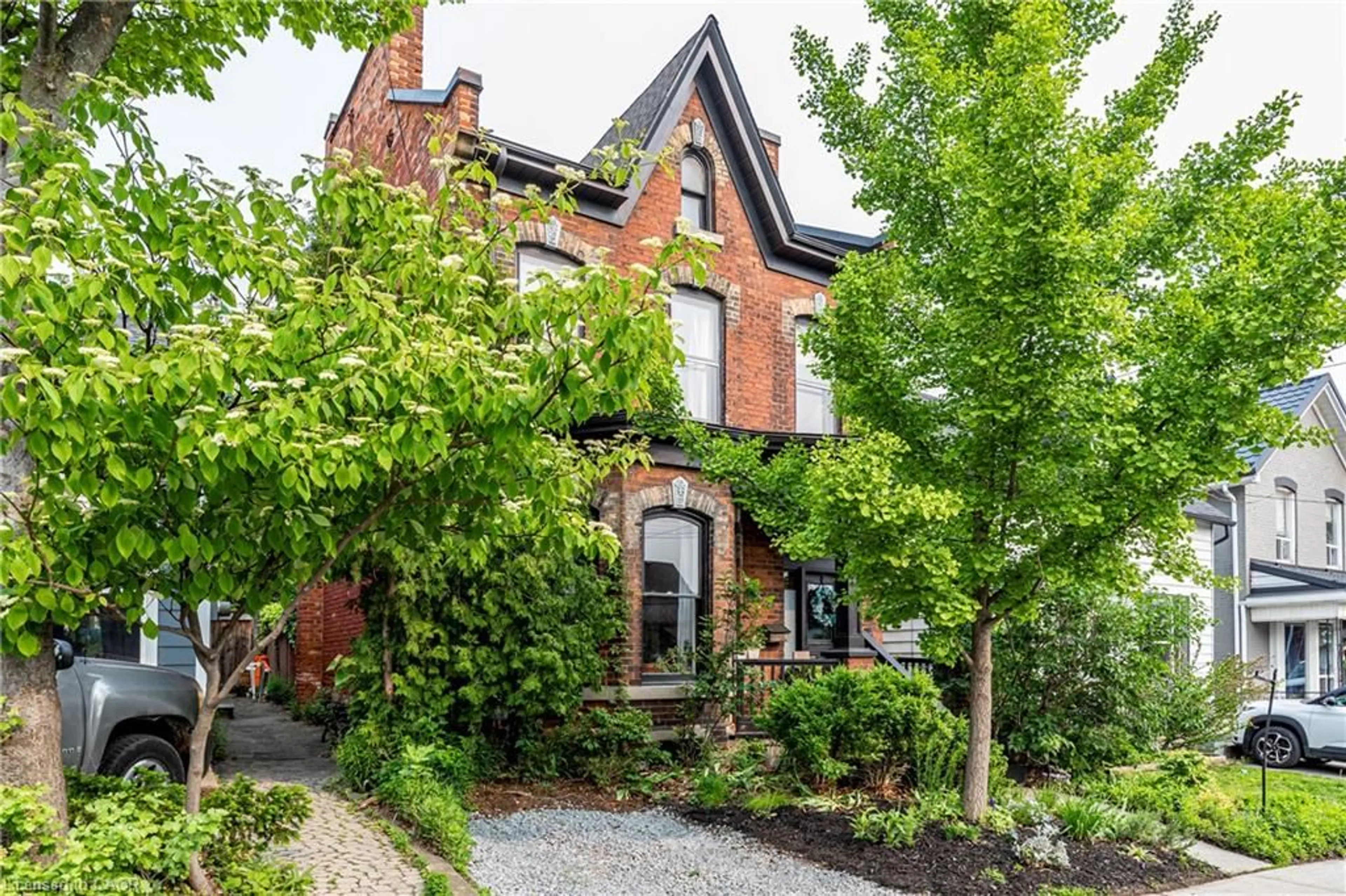 Home with brick exterior material, street for 115 Locke St, Hamilton Ontario L8R 3A7
