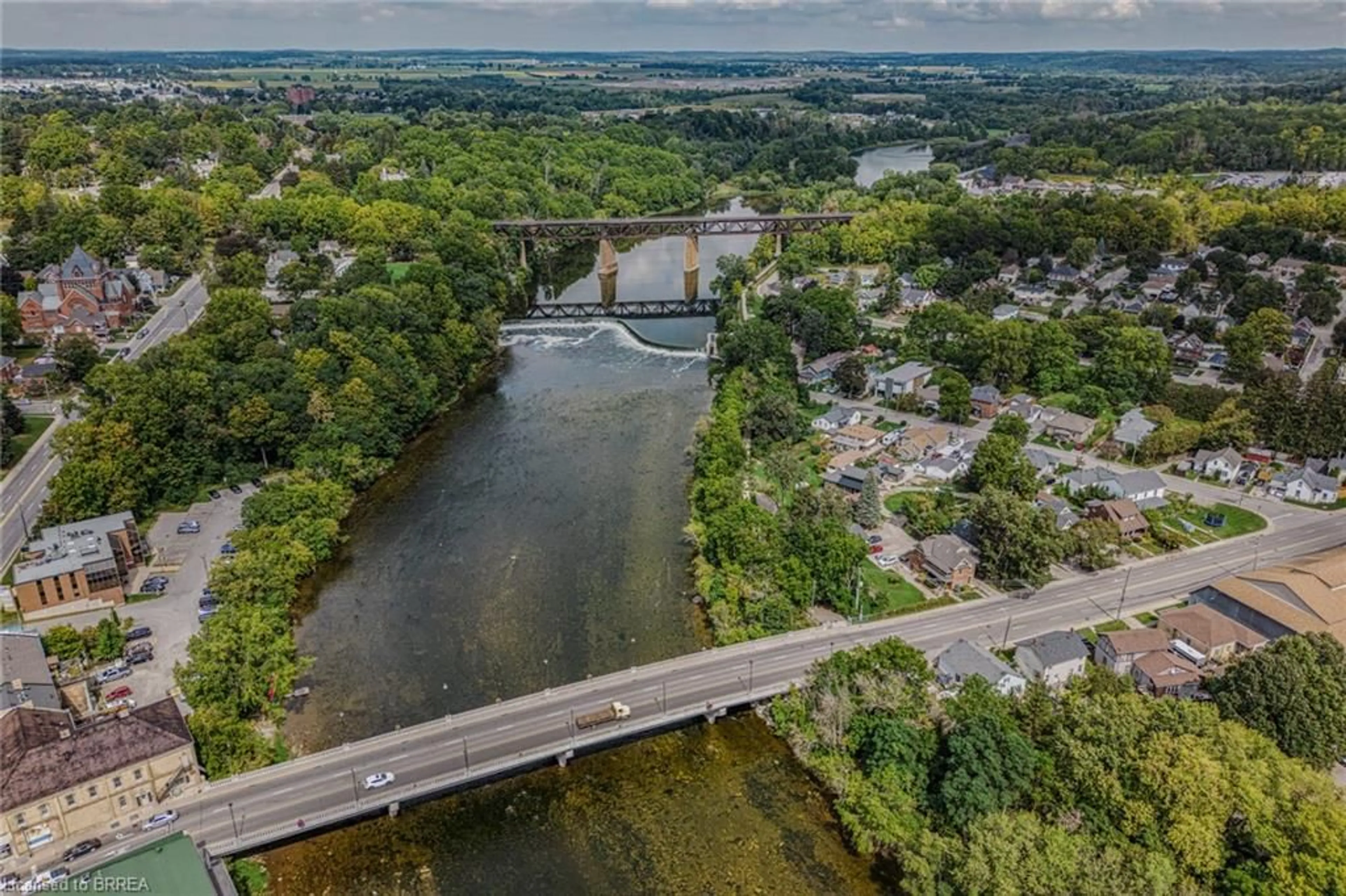 A pic from outside/outdoor area/front of a property/back of a property/a pic from drone, water/lake/river/ocean view for 80 West River St, Paris Ontario N3L 2V1
