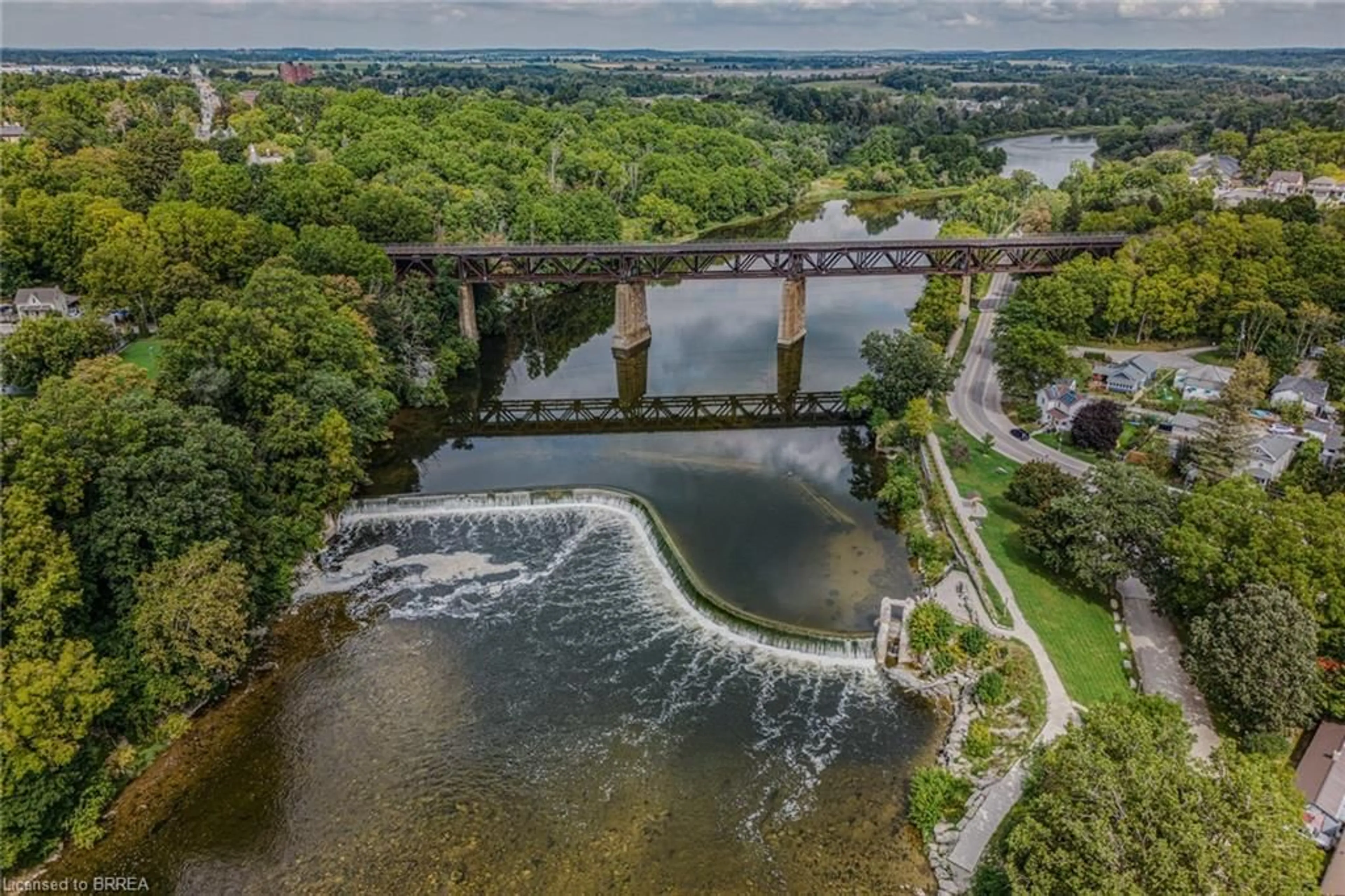 A pic from outside/outdoor area/front of a property/back of a property/a pic from drone, water/lake/river/ocean view for 80 West River St, Paris Ontario N3L 2V1