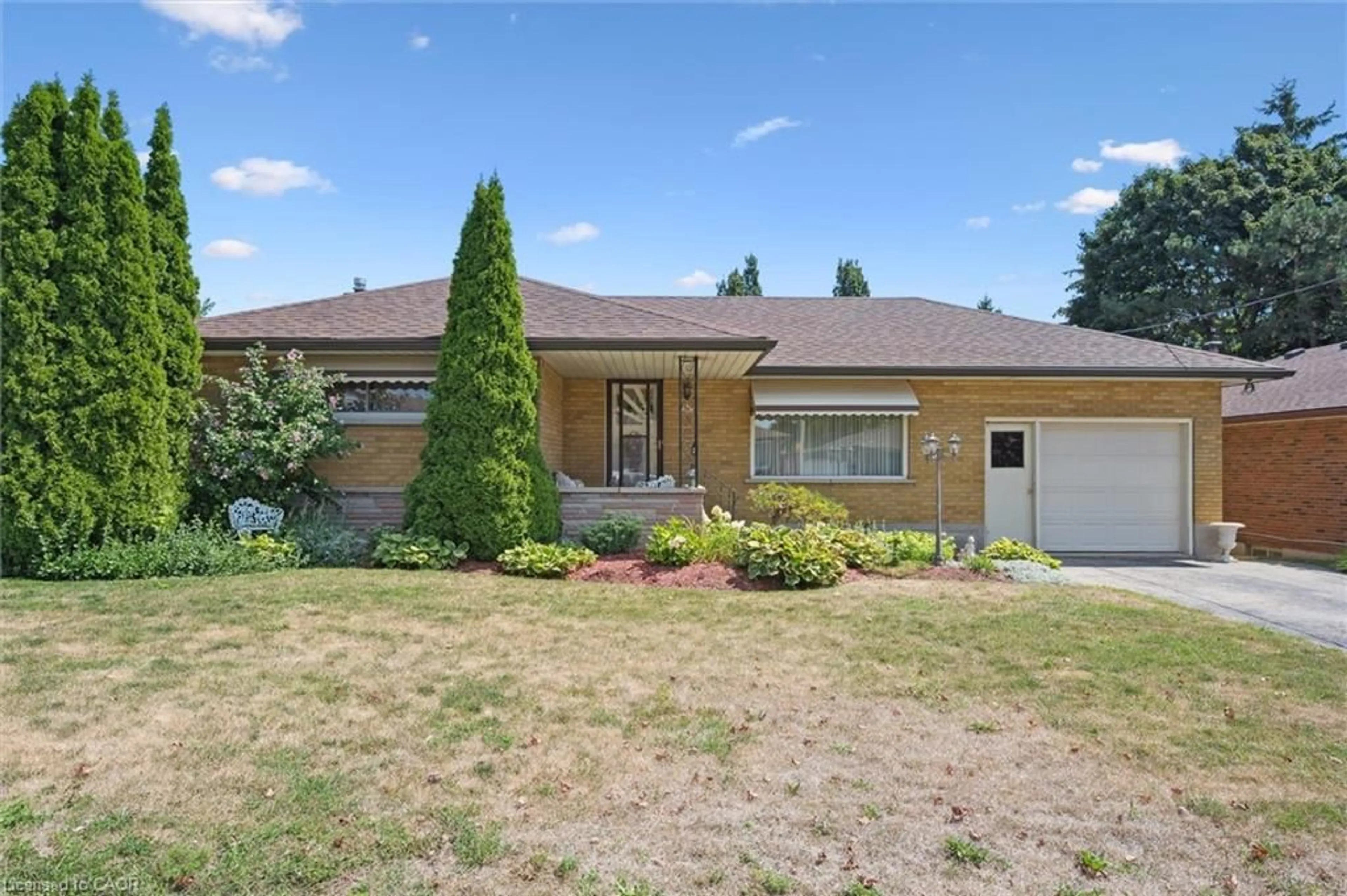 Home with brick exterior material, street for 61 Traynor Ave, Kitchener Ontario N2C 1W1