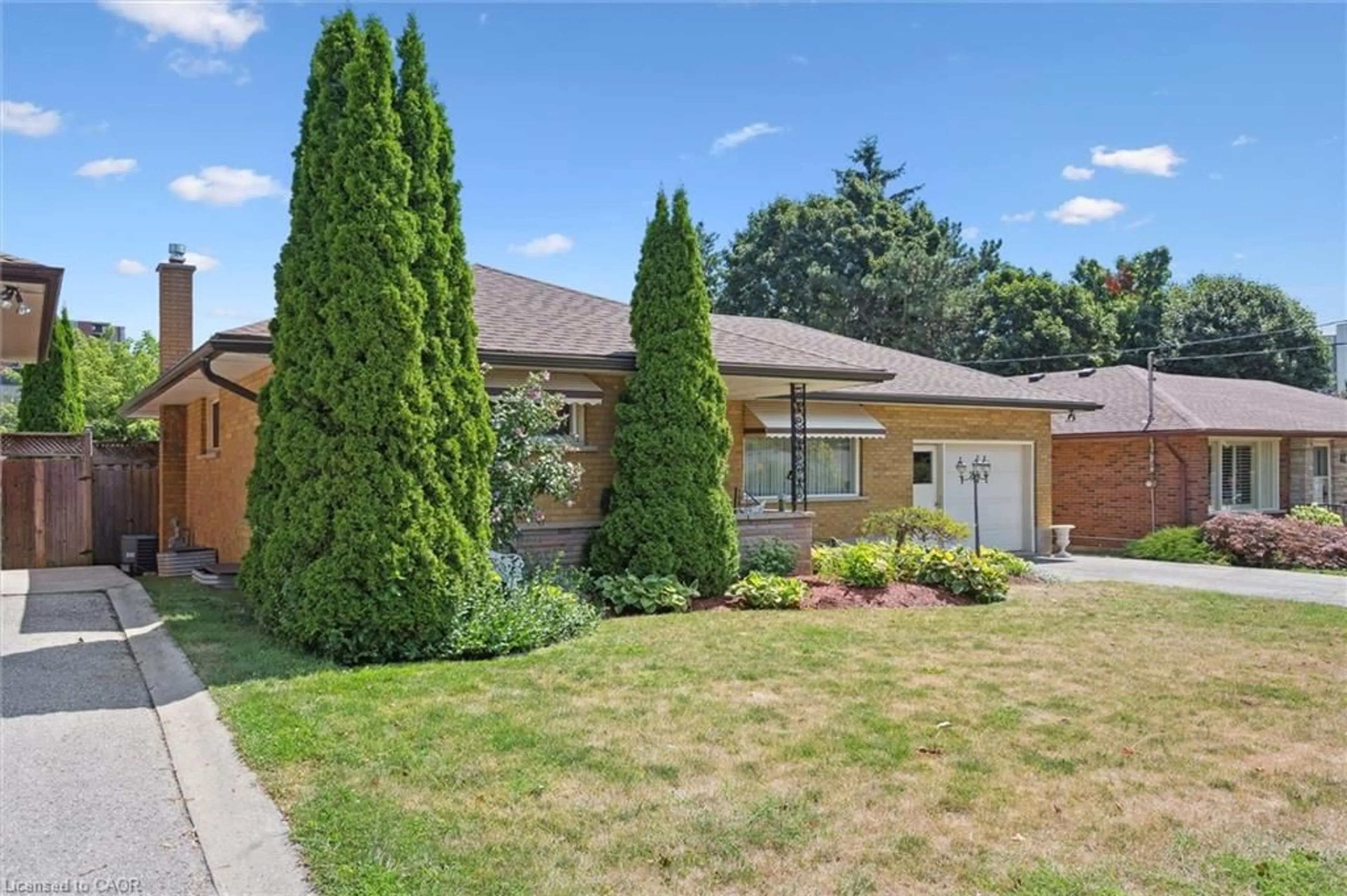 Home with brick exterior material, street for 61 Traynor Ave, Kitchener Ontario N2C 1W1
