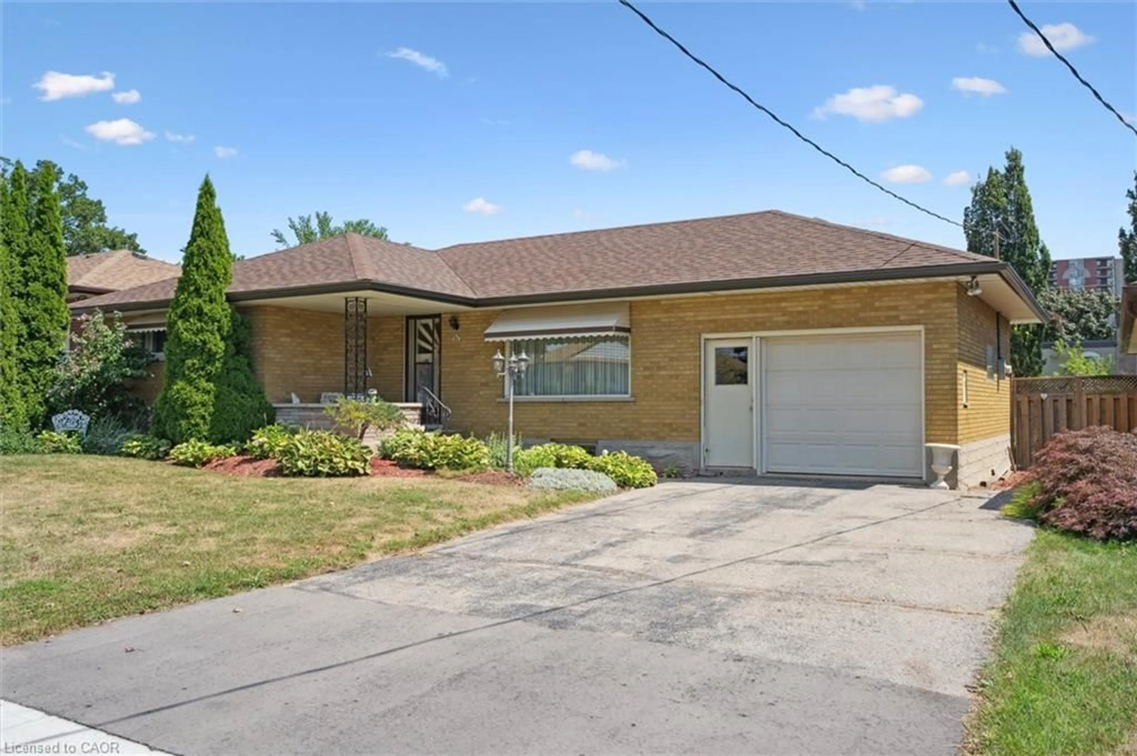 Home with brick exterior material, street for 61 Traynor Ave, Kitchener Ontario N2C 1W1