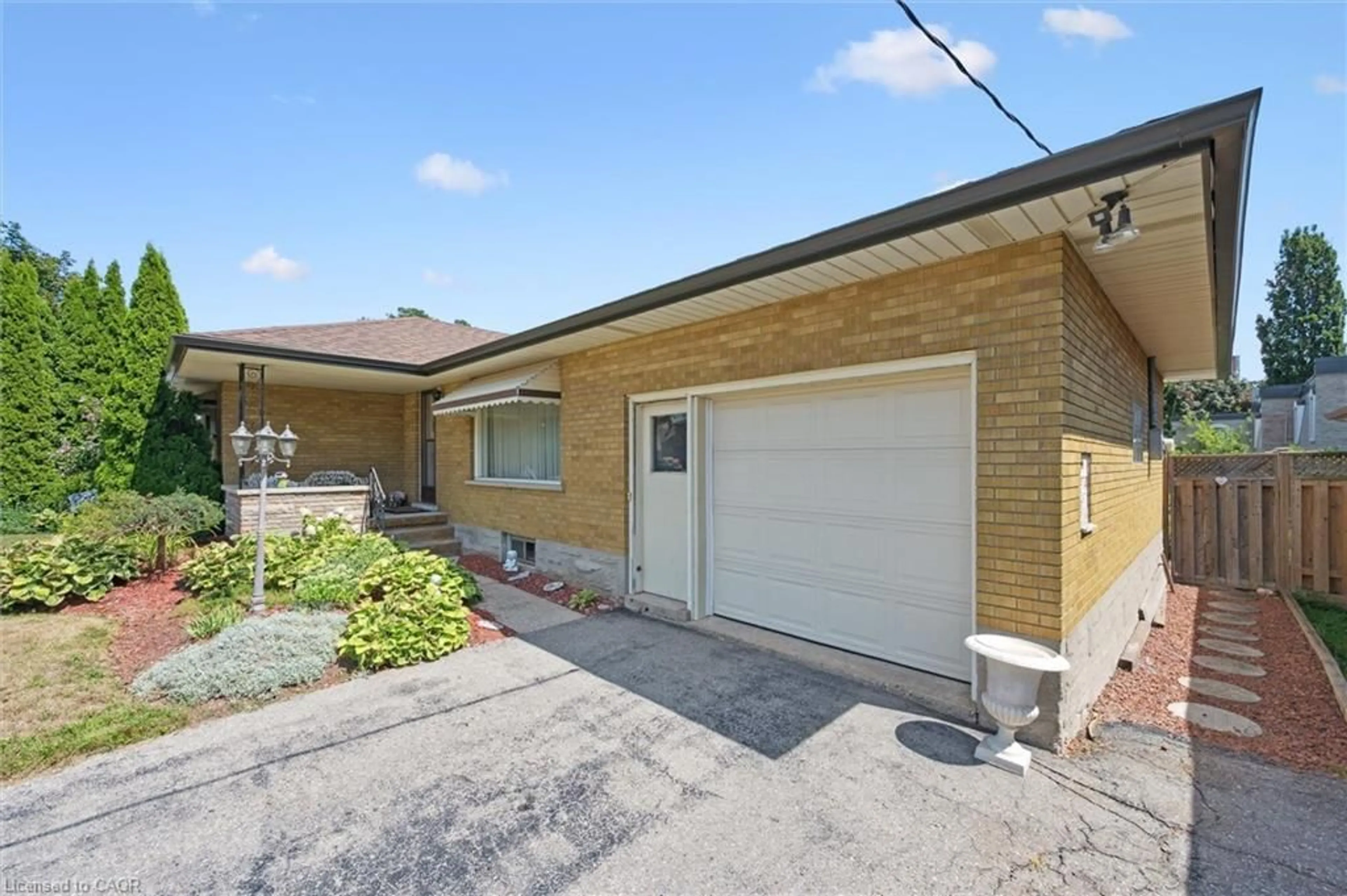 Home with brick exterior material, street for 61 Traynor Ave, Kitchener Ontario N2C 1W1