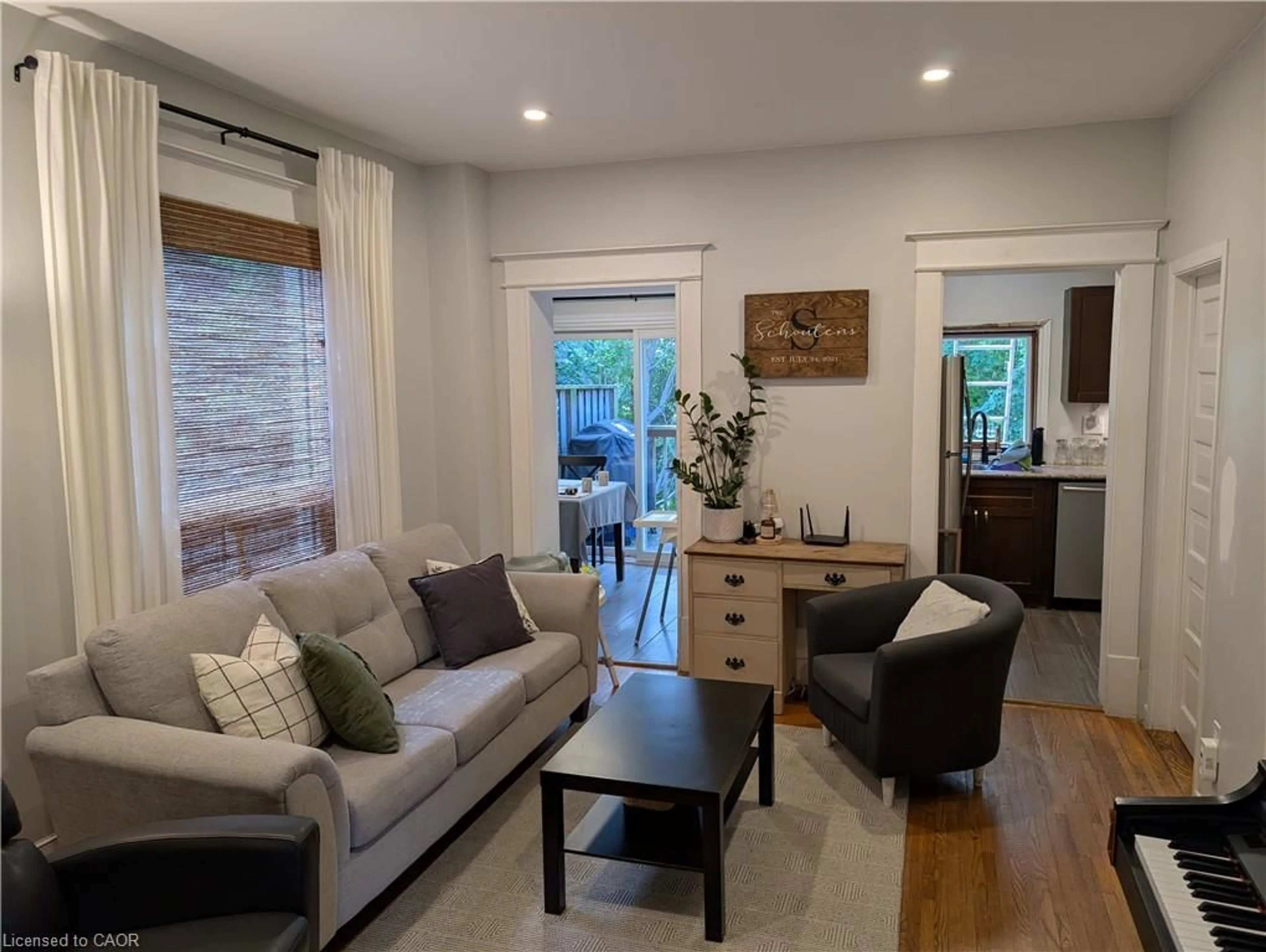 Living room with furniture, wood/laminate floor for 86 Park Ave, Brantford Ontario N3S 5H6