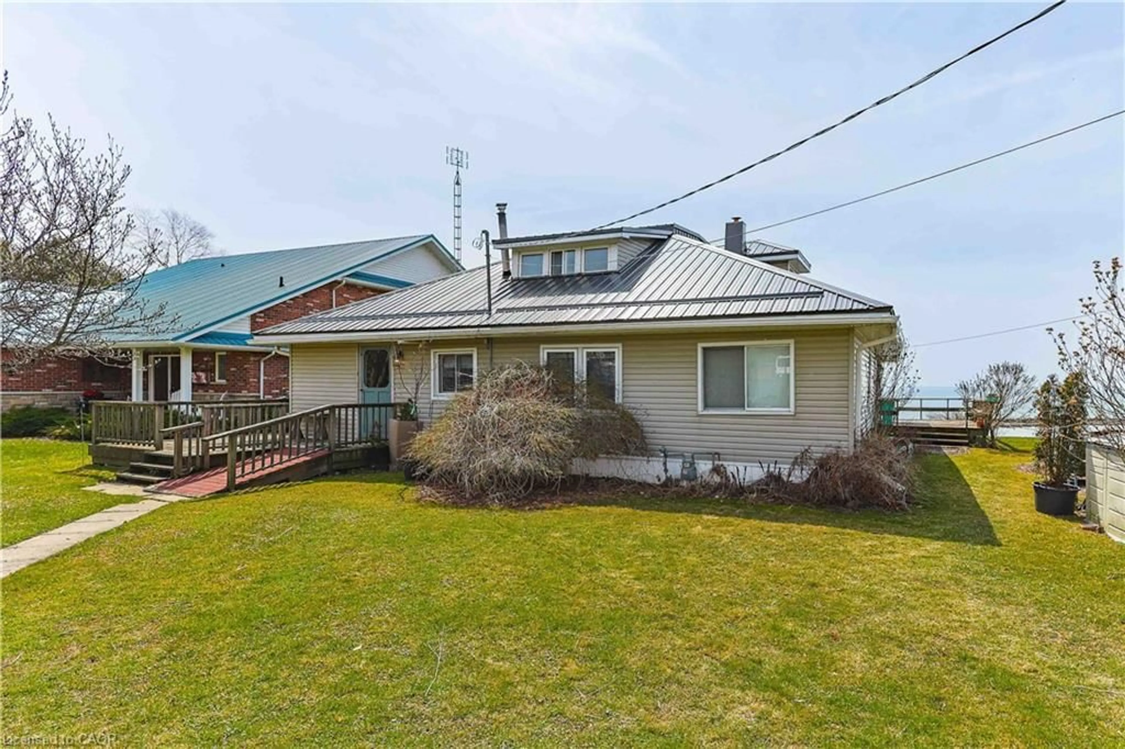 A pic from outside/outdoor area/front of a property/back of a property/a pic from drone, water/lake/river/ocean view for 78 Brown St, Port Dover Ontario N0A 1N7
