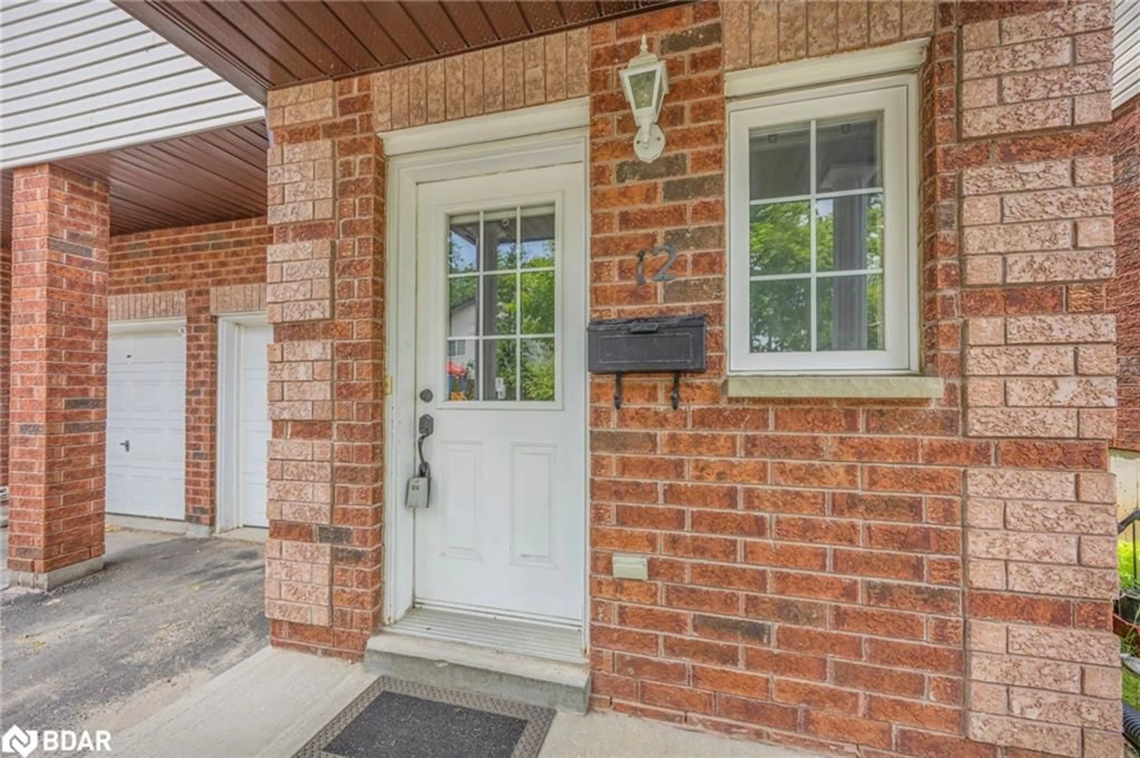 Home with brick exterior material, street for 488 Yonge Street St #12, Barrie Ontario L4N 4E2