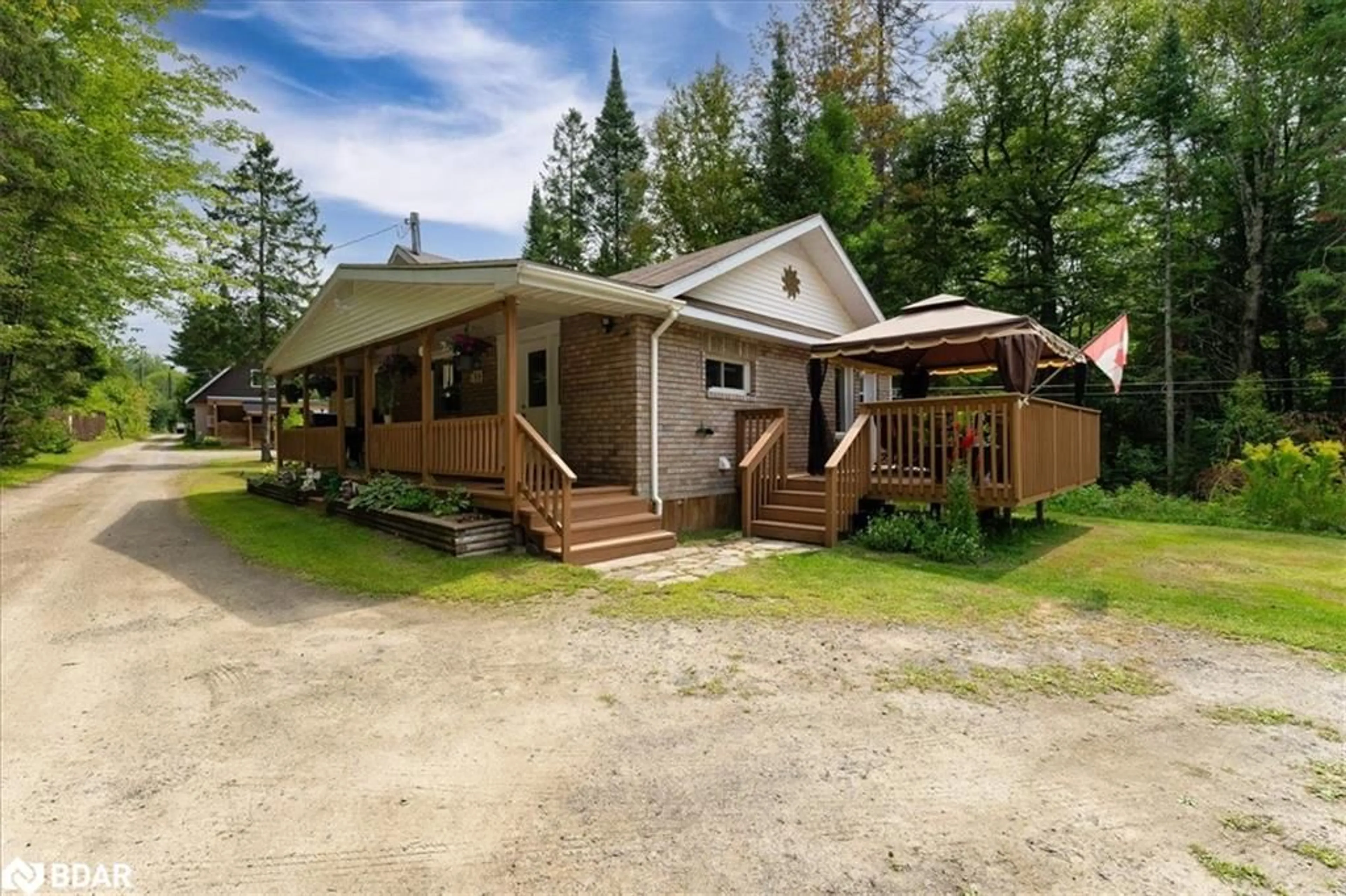 A pic from outside/outdoor area/front of a property/back of a property/a pic from drone, street for 788 Muskoka Rd 3 Rd, Huntsville Ontario P1H 1E1