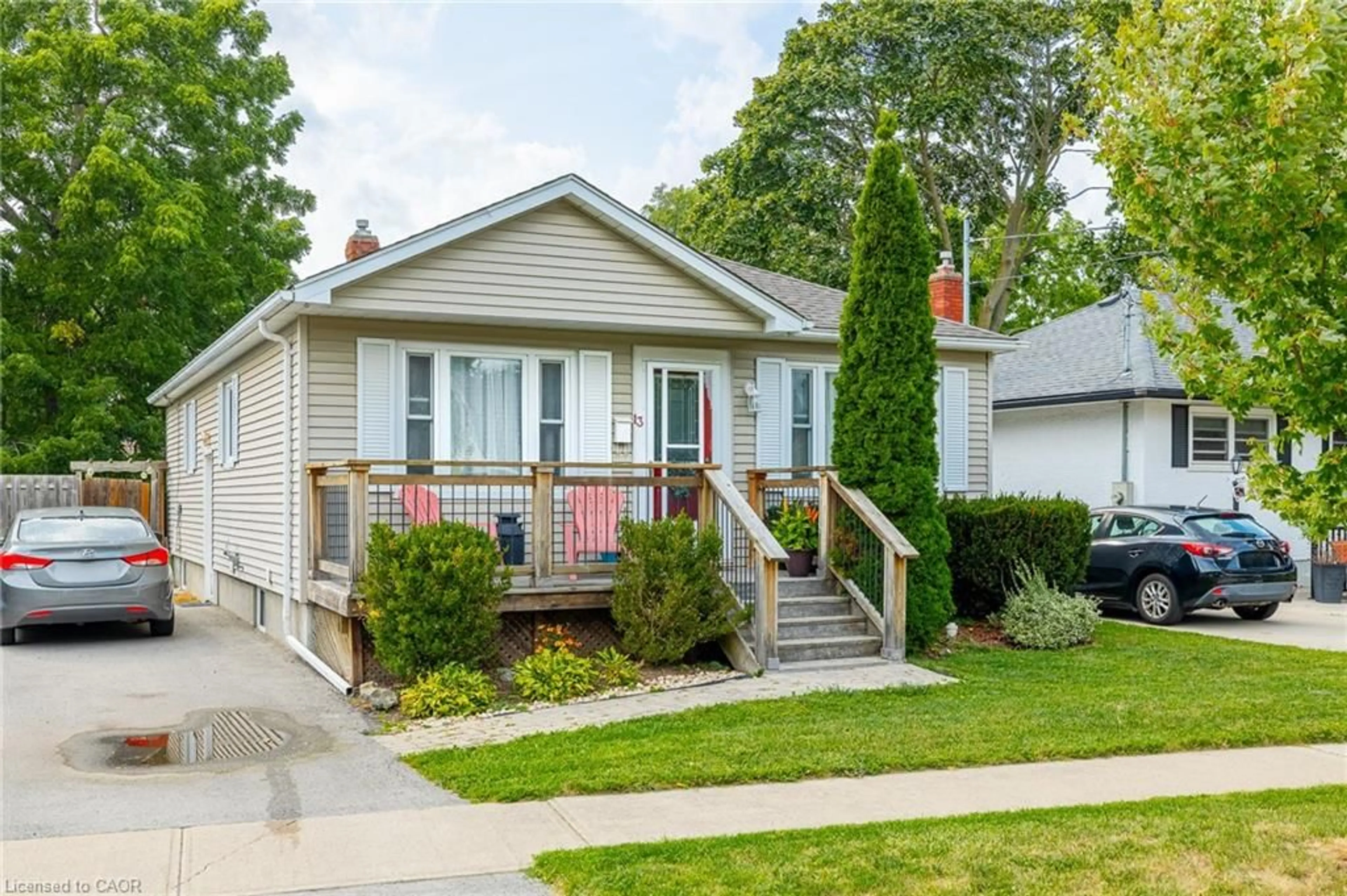 Home with vinyl exterior material, street for 13 Duncan Dr, St. Catharines Ontario L2N 3N8