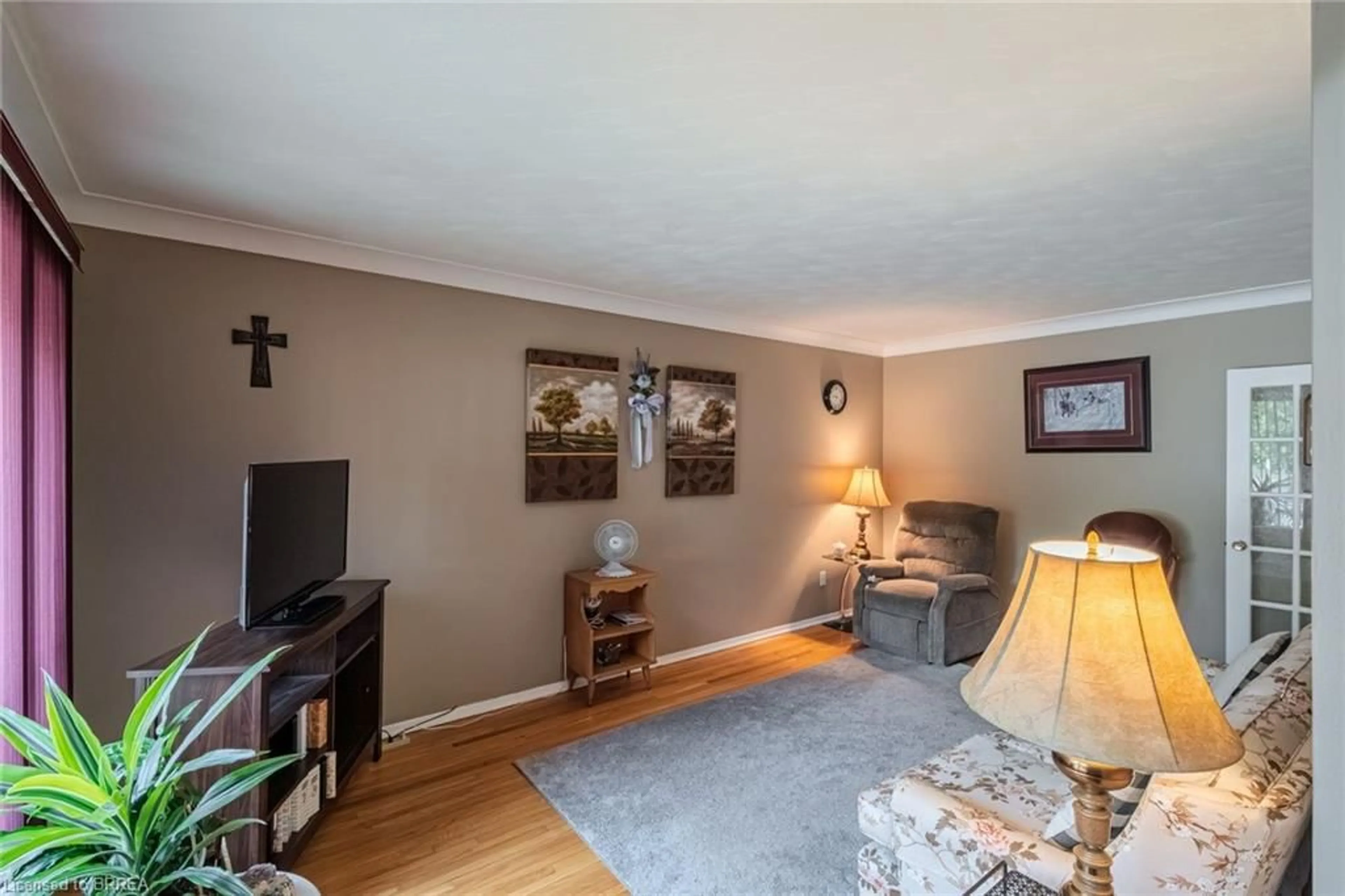 Living room with furniture, wood/laminate floor for 389 Nelson St, Brantford Ontario N3S 4E6