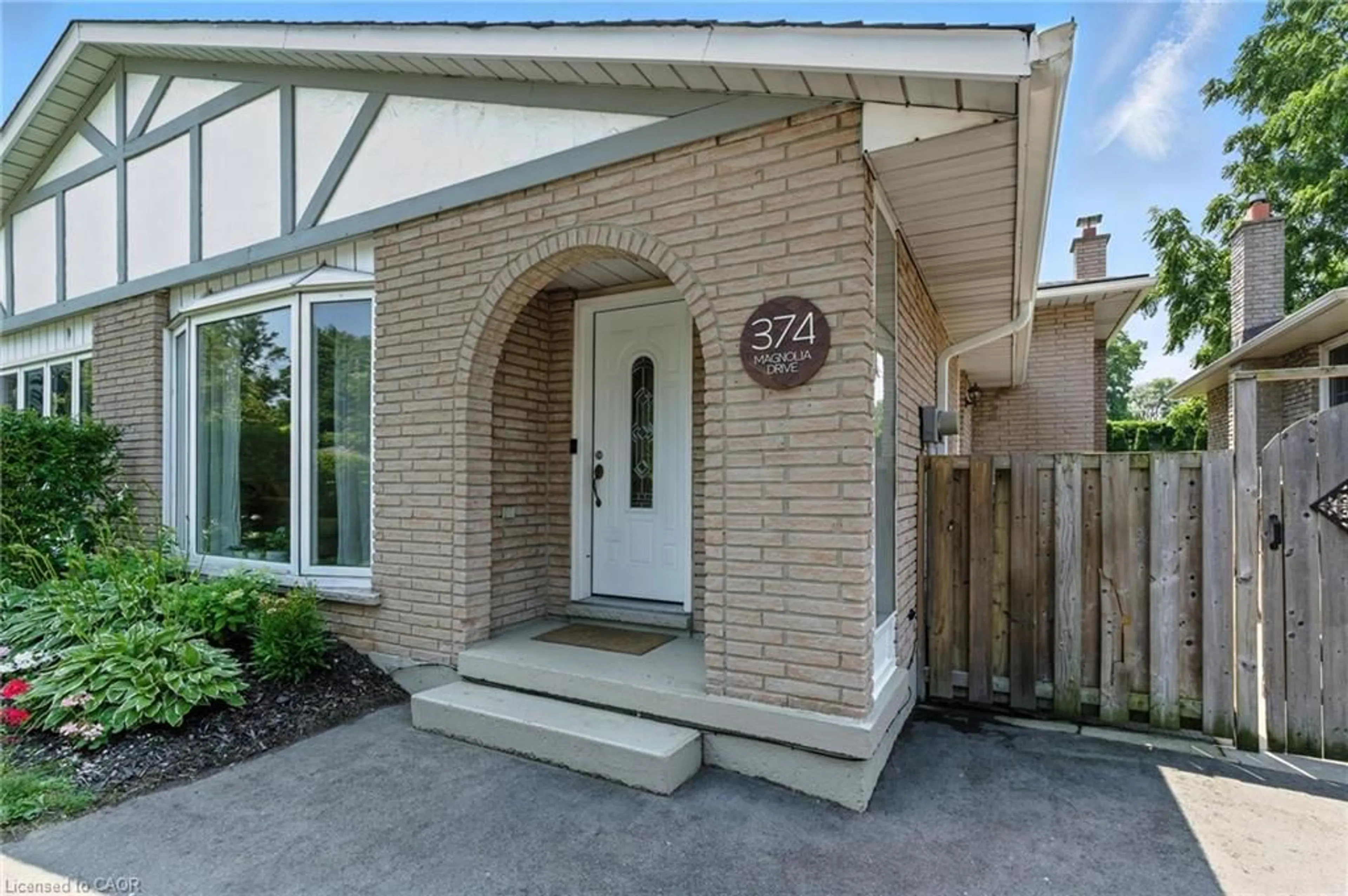 Home with brick exterior material, street for 374 Magnolia Dr, Hamilton Ontario L9C 6N7