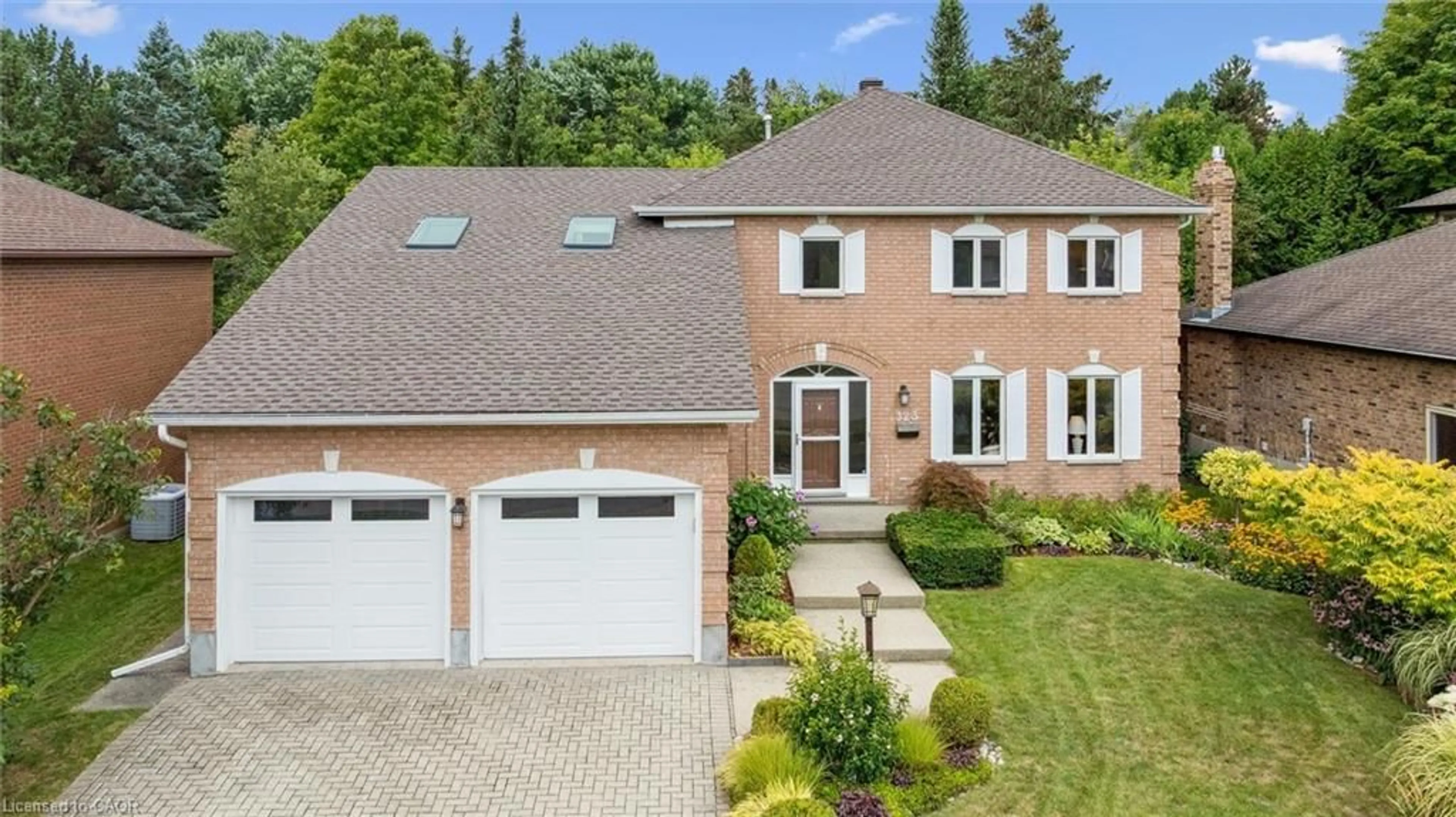 Home with brick exterior material, street for 323 Amberwood Dr, Waterloo Ontario N2T 2E9