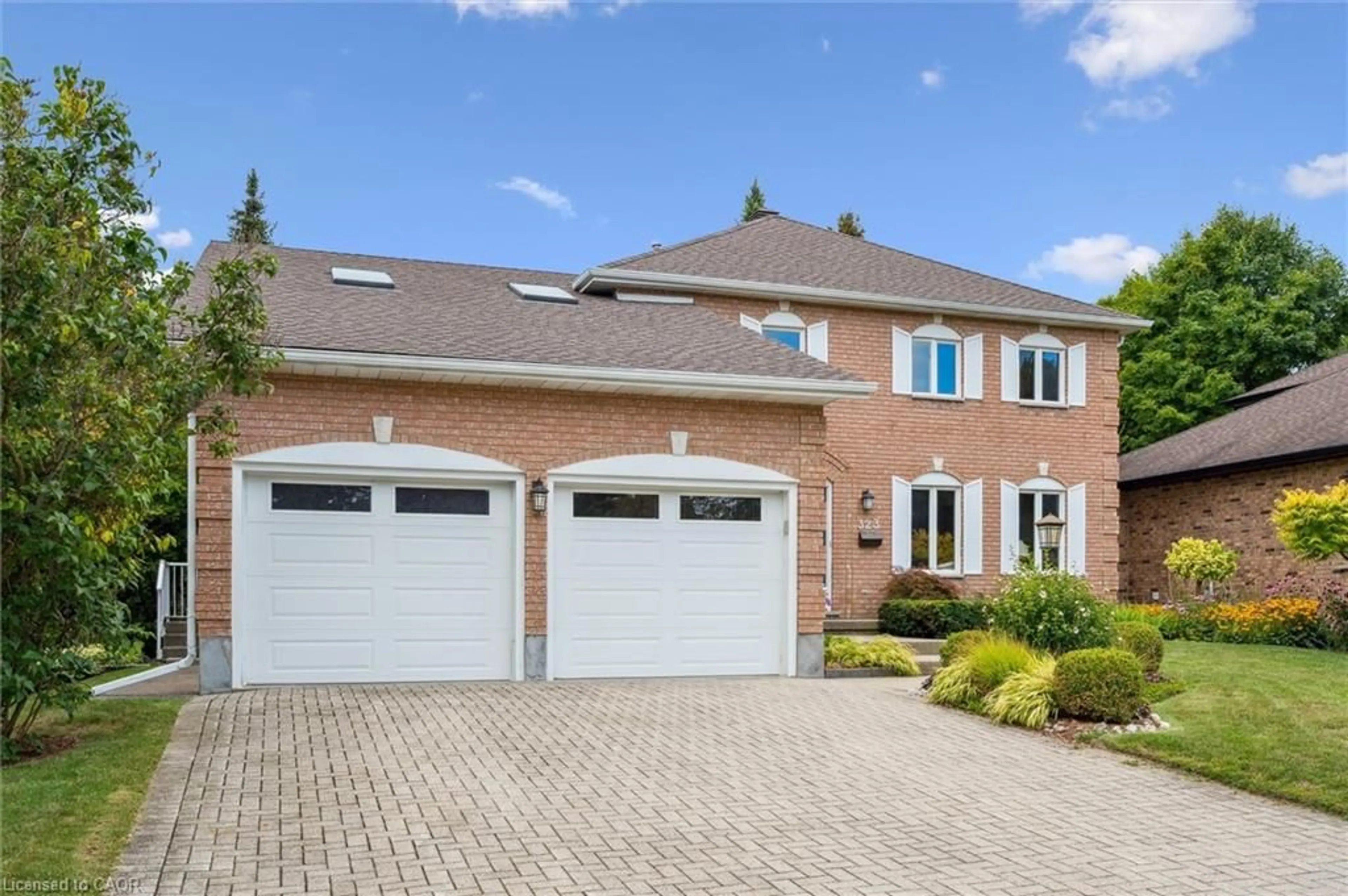 Home with brick exterior material, street for 323 Amberwood Dr, Waterloo Ontario N2T 2E9