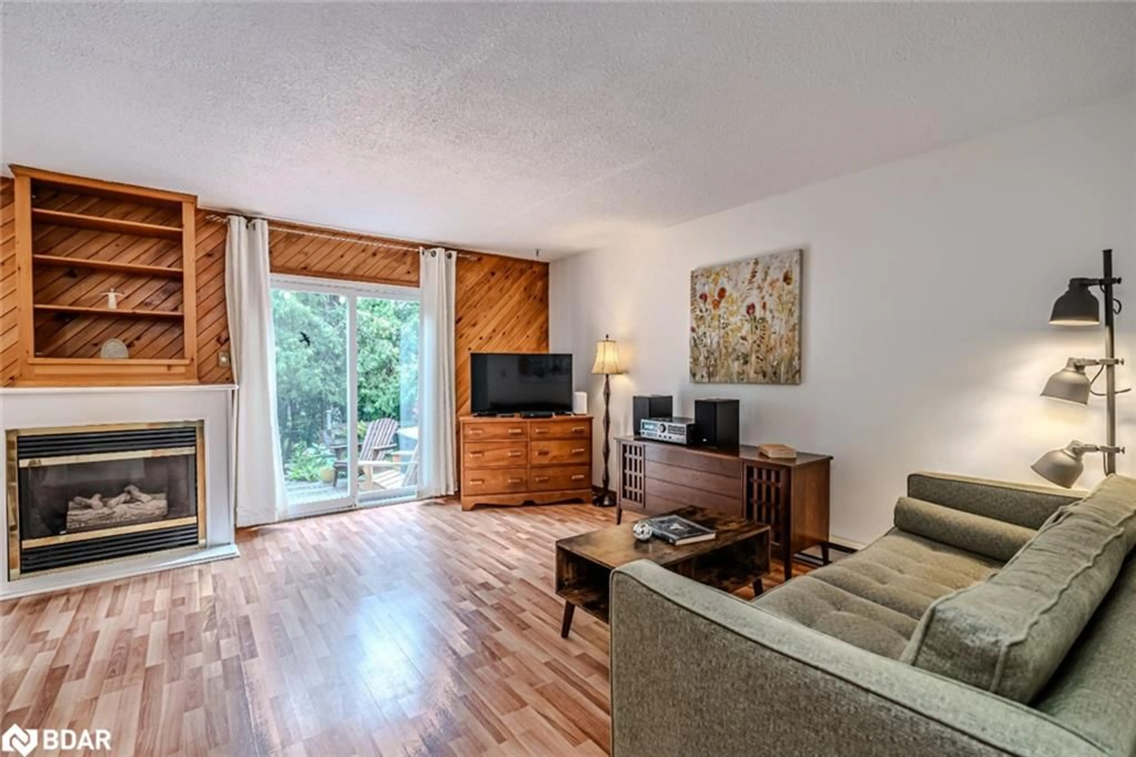 Living room with furniture, wood/laminate floor for 403 Maplegrove Ave, Bradford Ontario L3Z 1V8