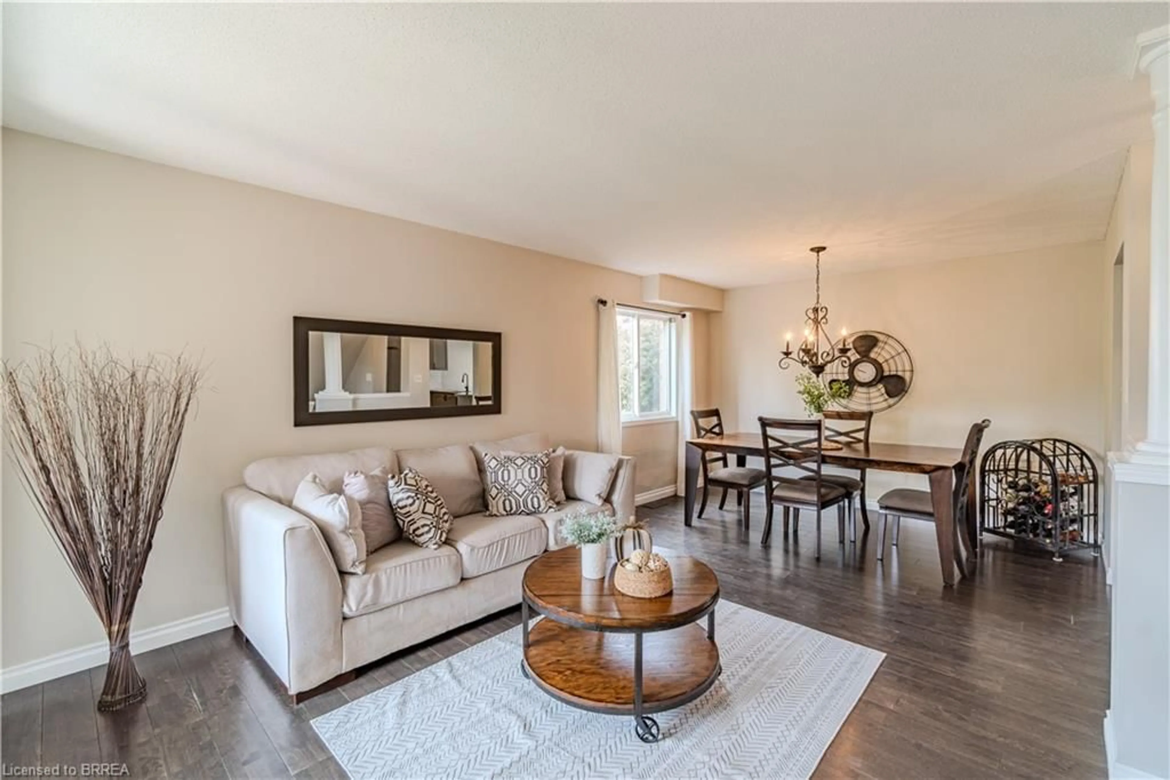 Living room with furniture, wood/laminate floor for 111 Amanda Walk, Cambridge Ontario N3C 4K7