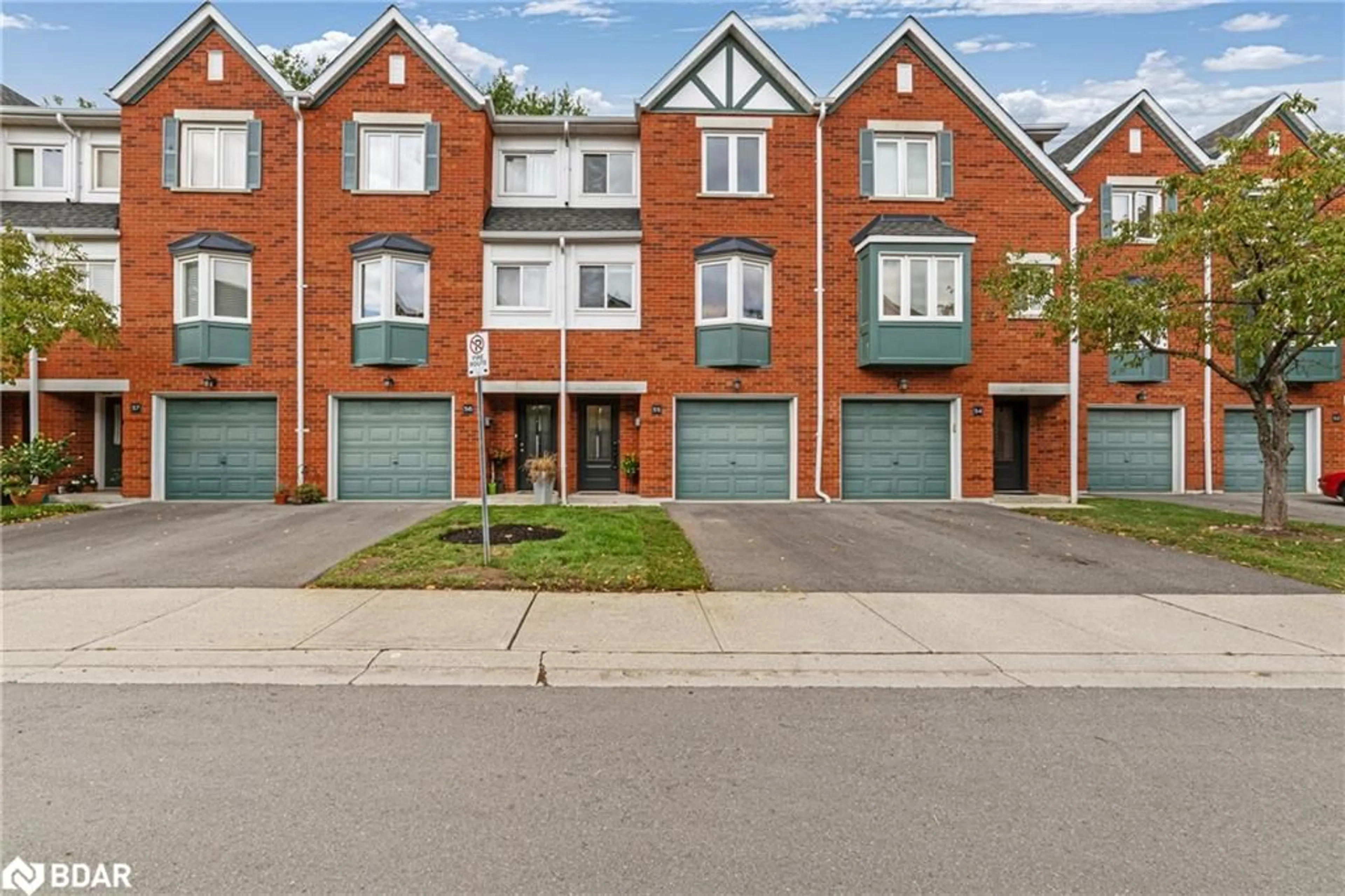 Home with brick exterior material, street for 2300 Brays Lane #55, Oakville Ontario L6M 3J9