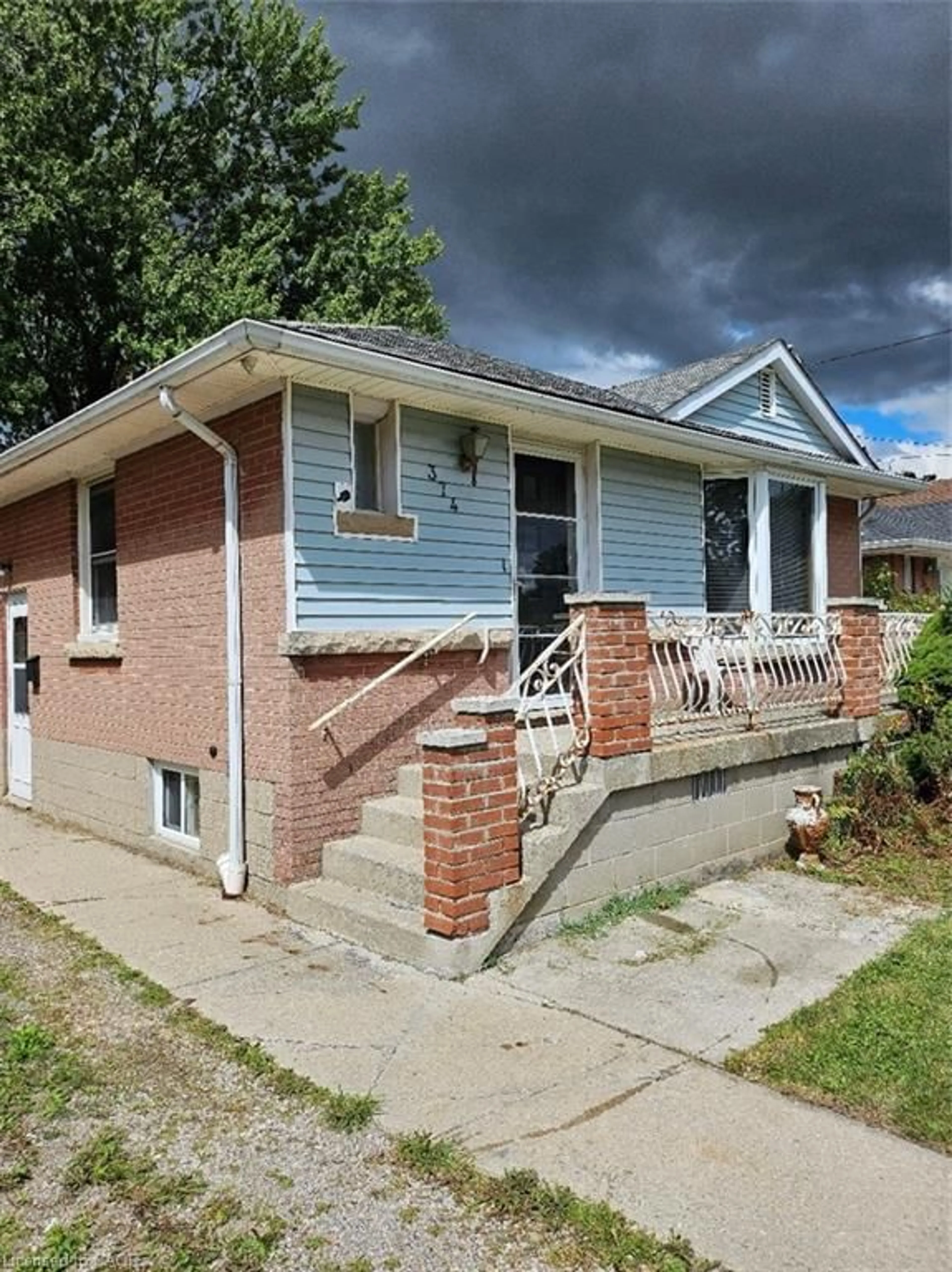 Home with brick exterior material, street for 374 East 13th St, Hamilton Ontario L9A 4A1