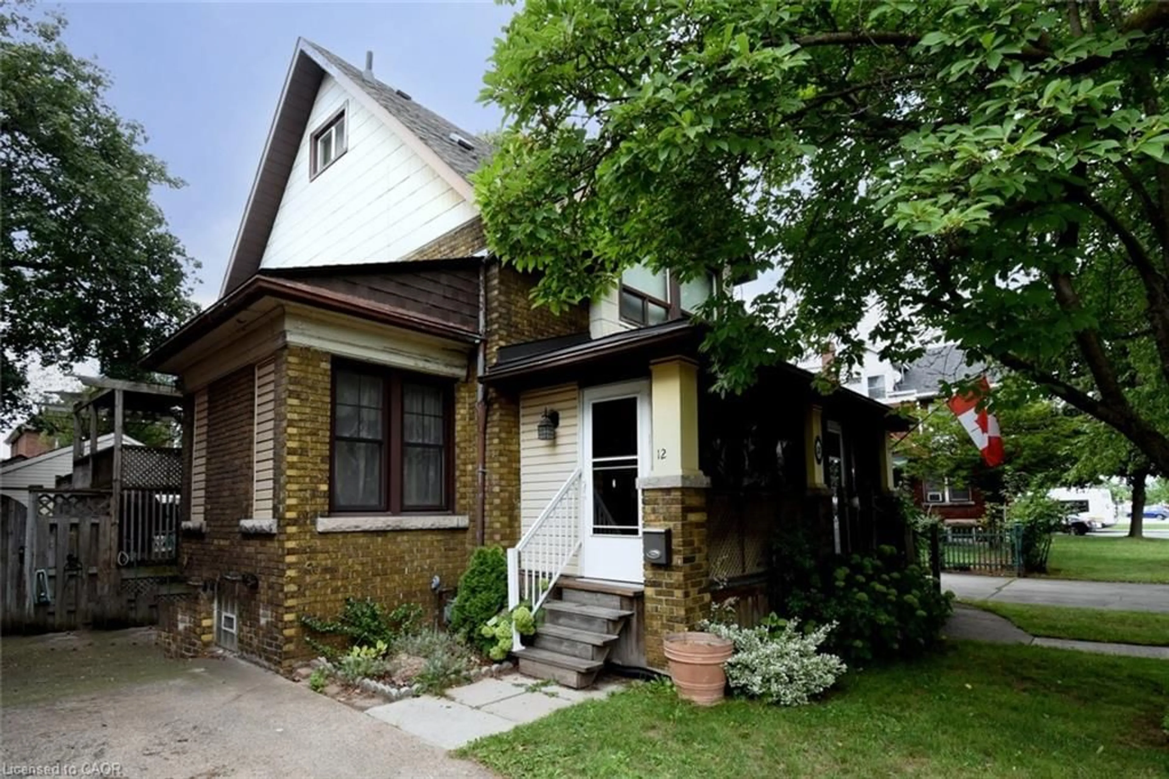 Home with brick exterior material, street for 12 Leinster Ave, Hamilton Ontario L8M 3A1