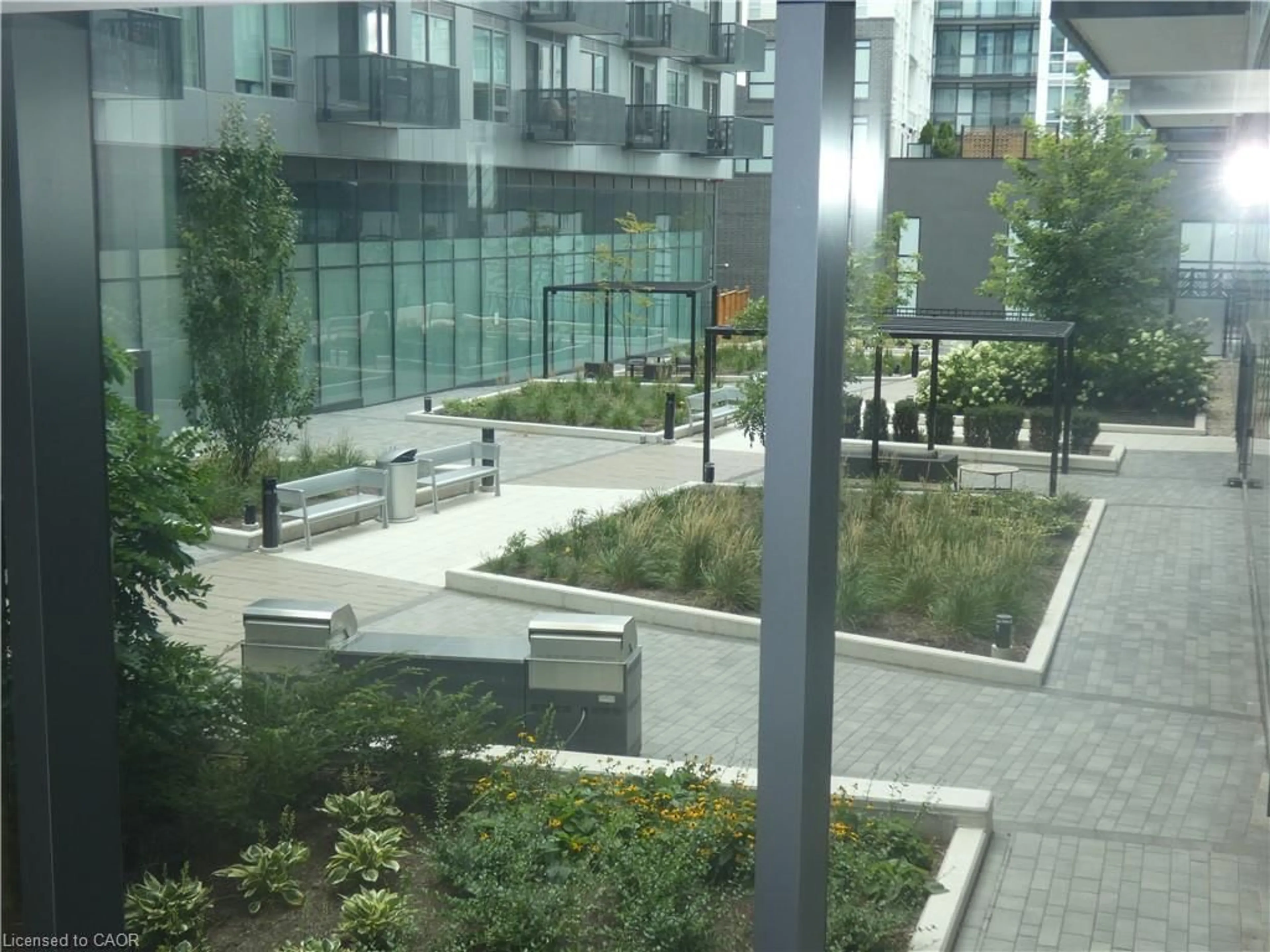 Patio, city buildings view from balcony for 2450 Old Bronte Road Rd #112, Oakville Ontario L6M 5P6