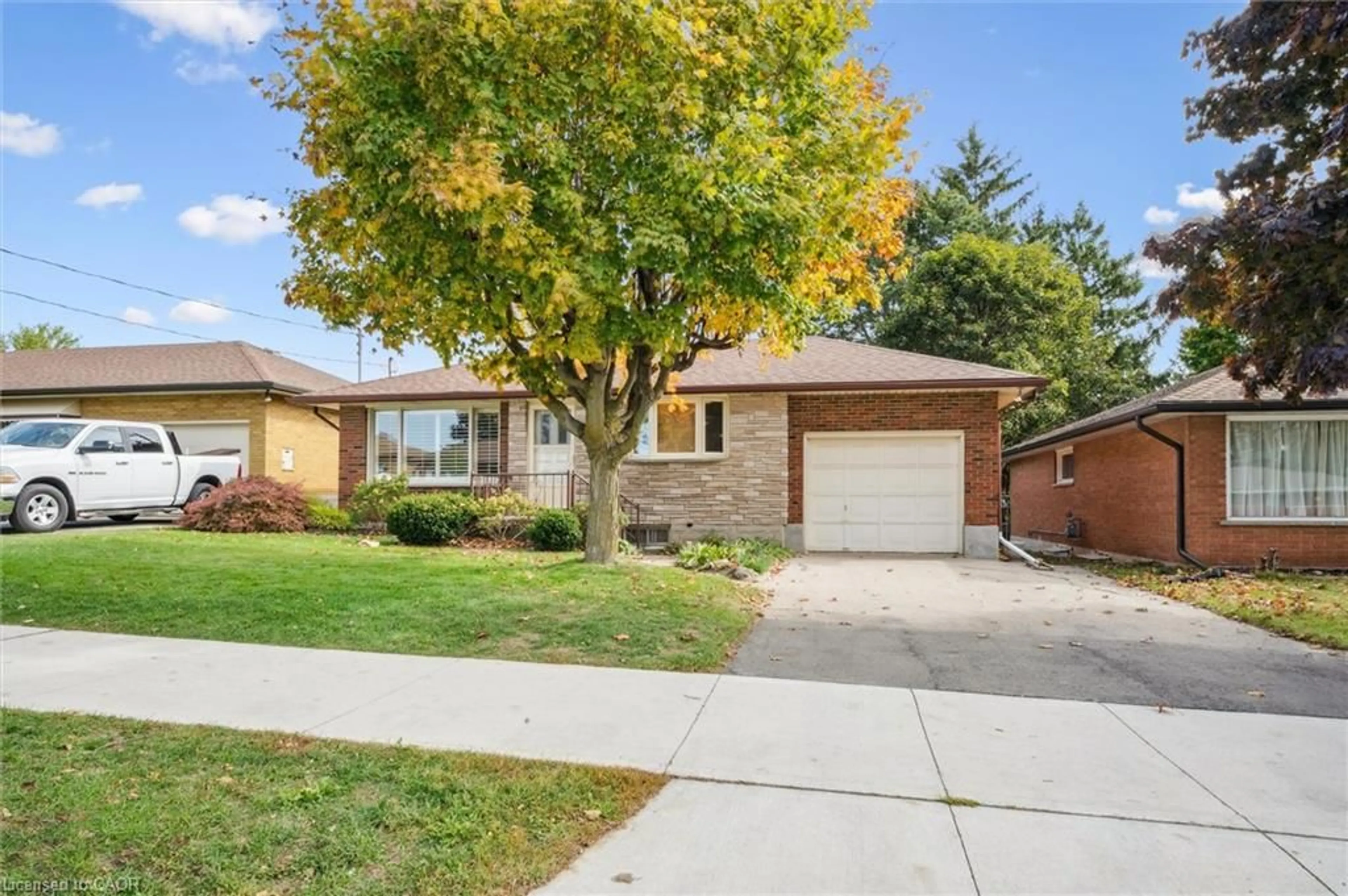 Home with brick exterior material, street for 67 Traynor Ave, Kitchener Ontario N2C 1W1