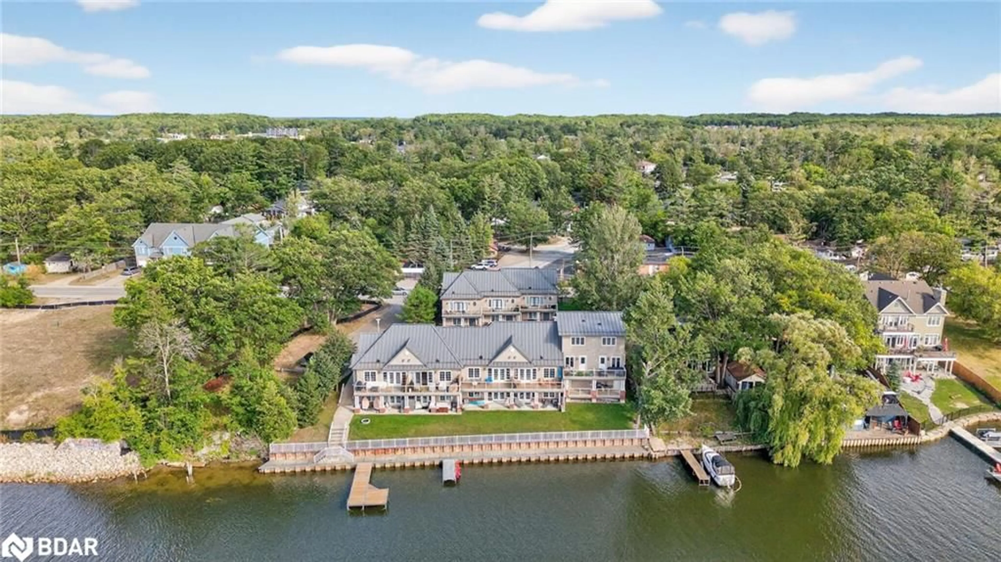 A pic from outside/outdoor area/front of a property/back of a property/a pic from drone, water/lake/river/ocean view for 64 River Road East Rd #3, Wasaga Beach Ontario L9Z 2L1