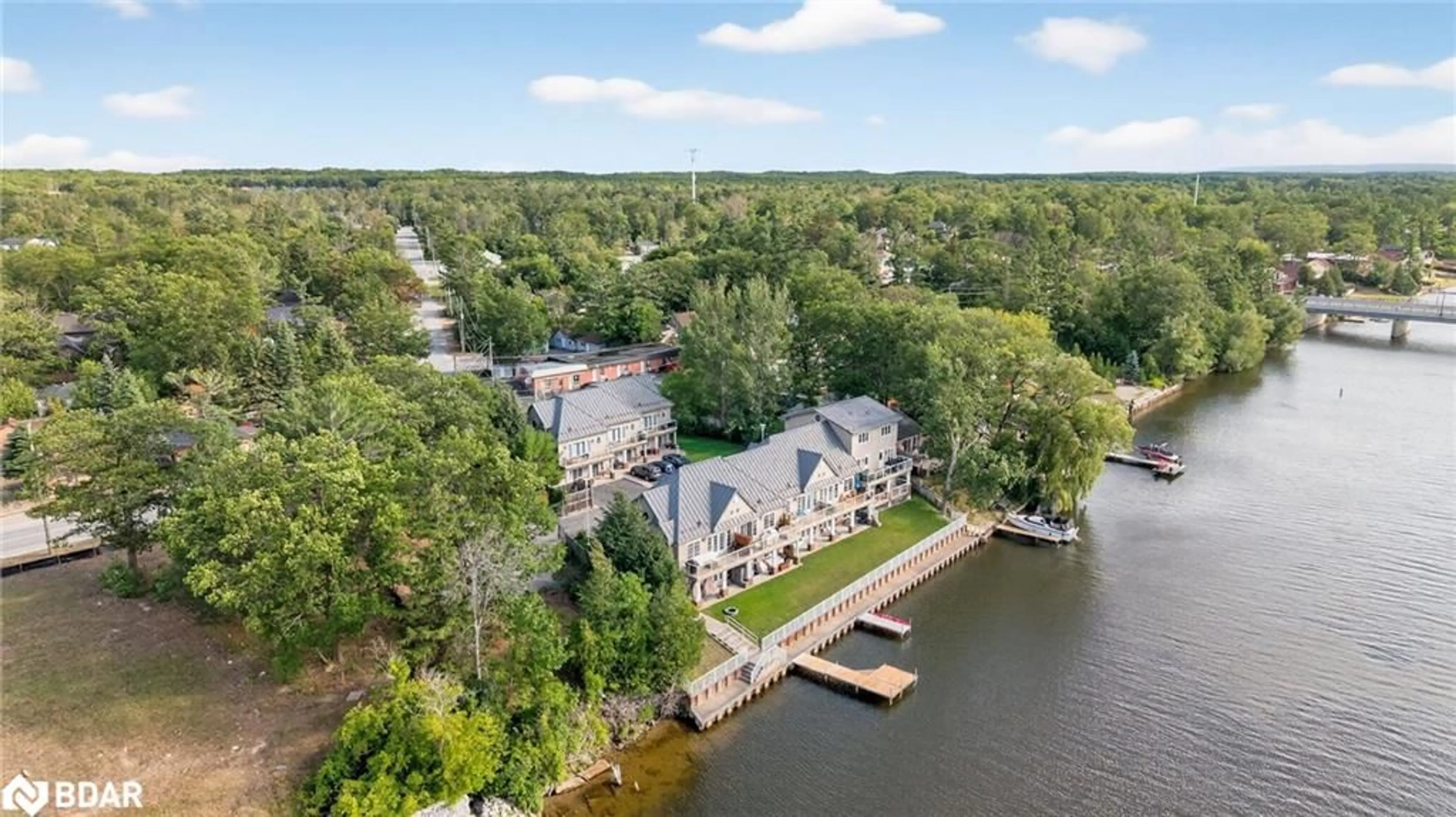A pic from outside/outdoor area/front of a property/back of a property/a pic from drone, water/lake/river/ocean view for 64 River Road East Rd #3, Wasaga Beach Ontario L9Z 2L1