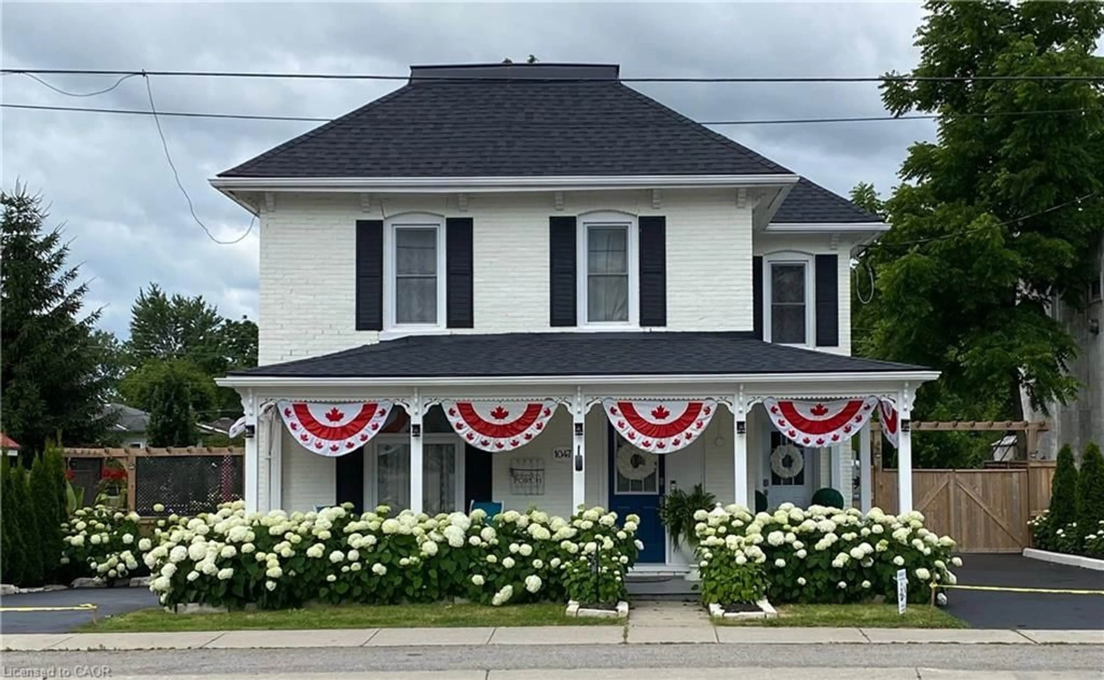 Home with vinyl exterior material, street for 1047 Bay Street, Port Rowan Ontario N0E 1M0