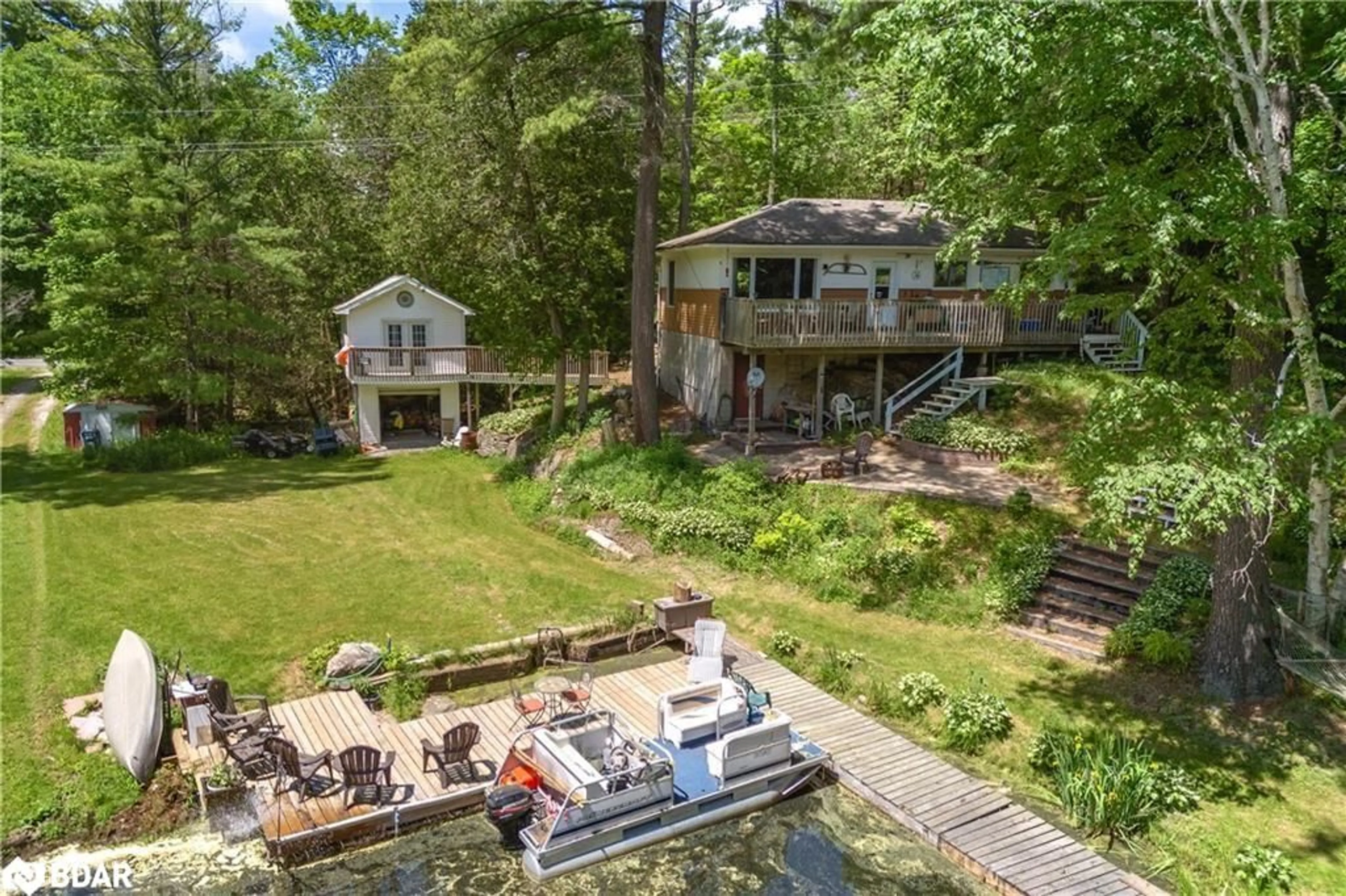 A pic from outside/outdoor area/front of a property/back of a property/a pic from drone, water/lake/river/ocean view for 2735 Shepherd Lane, Selwyn Ontario K0L 2H0