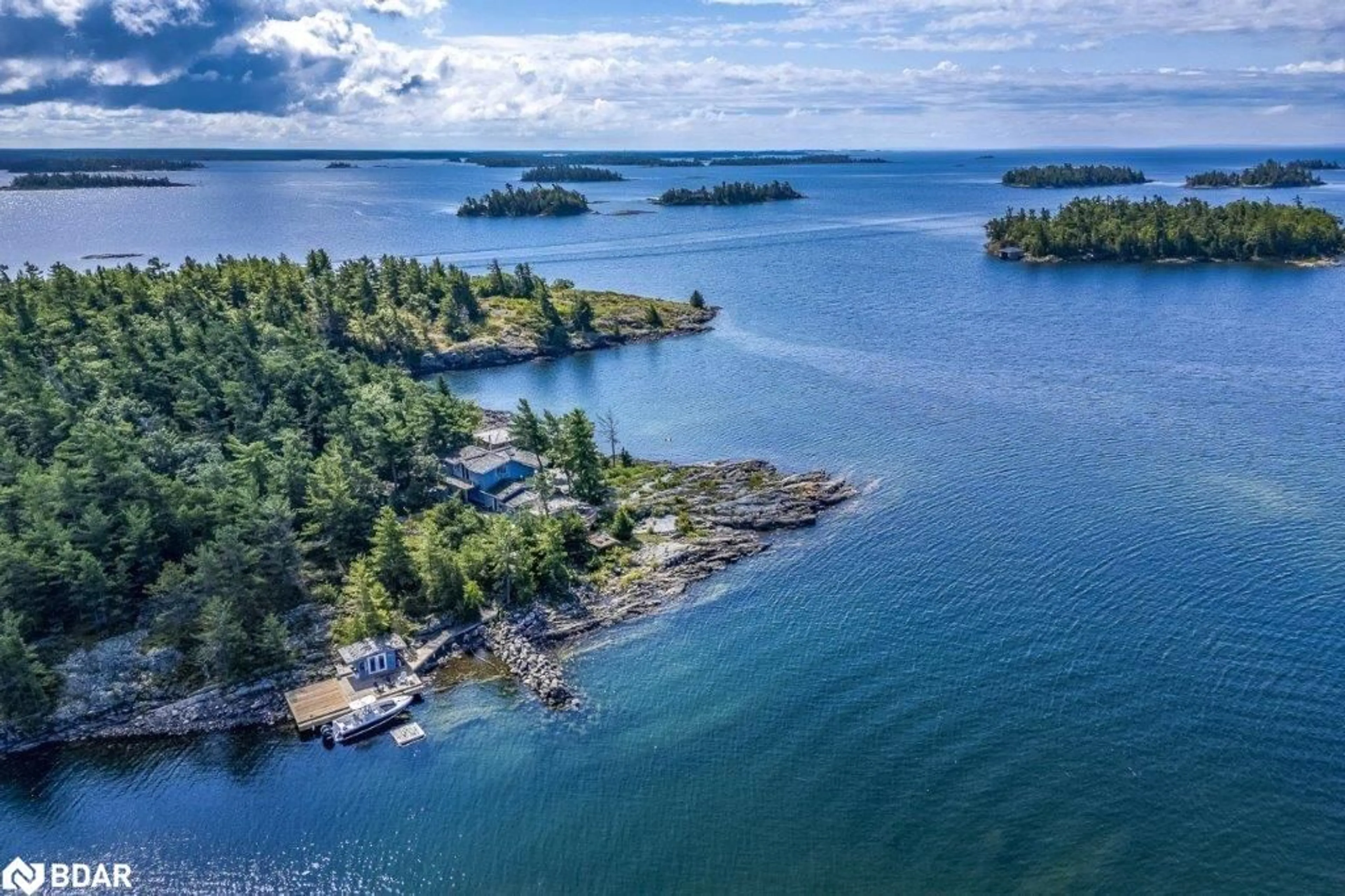 A pic from outside/outdoor area/front of a property/back of a property/a pic from drone, water/lake/river/ocean view for B433 Campbell Island, Parry Sound Ontario P0G 1G0