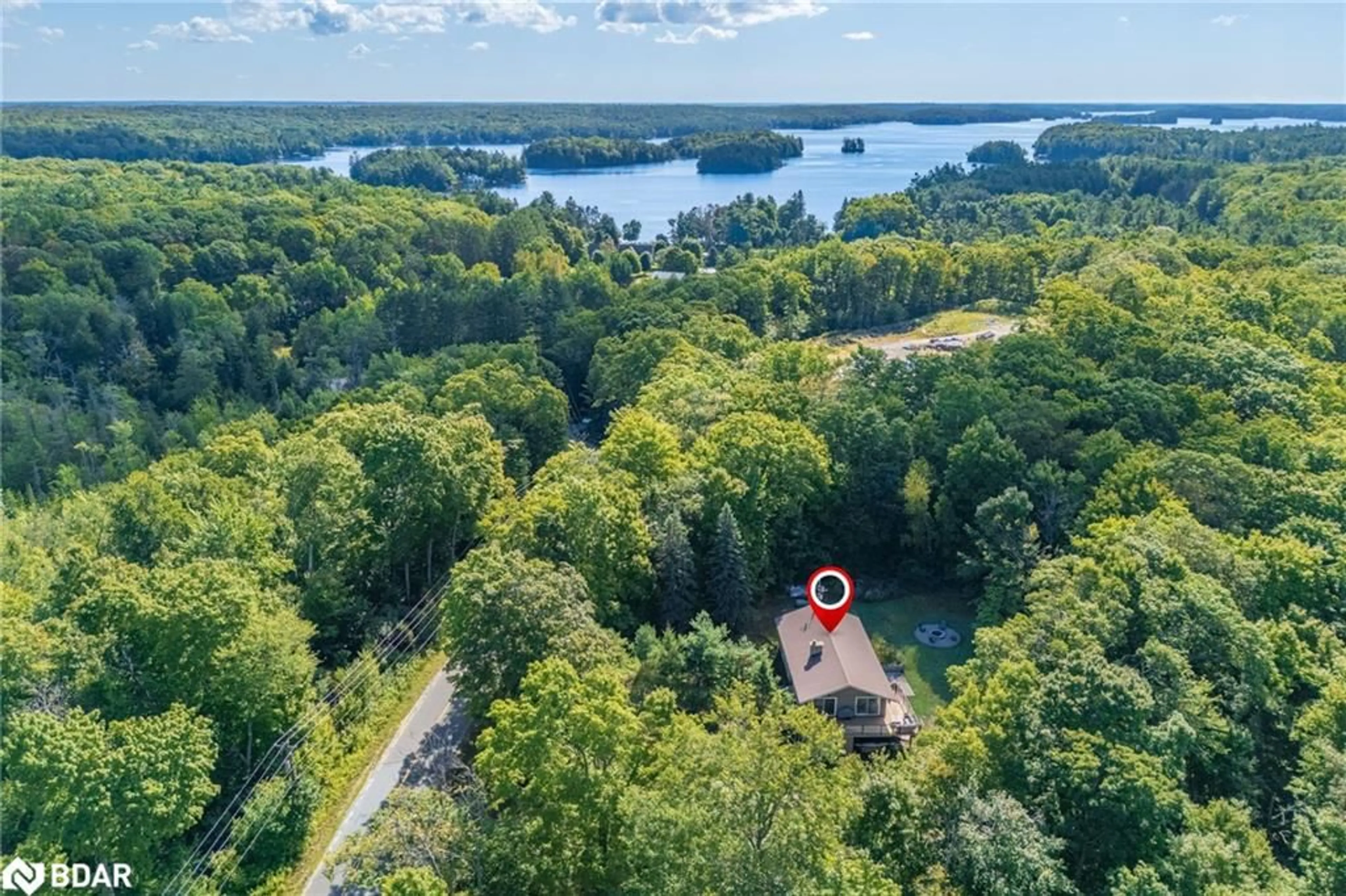 A pic from outside/outdoor area/front of a property/back of a property/a pic from drone, water/lake/river/ocean view for 1100 Mortimers Point Rd, Muskoka Lakes Ontario P0B 1J0
